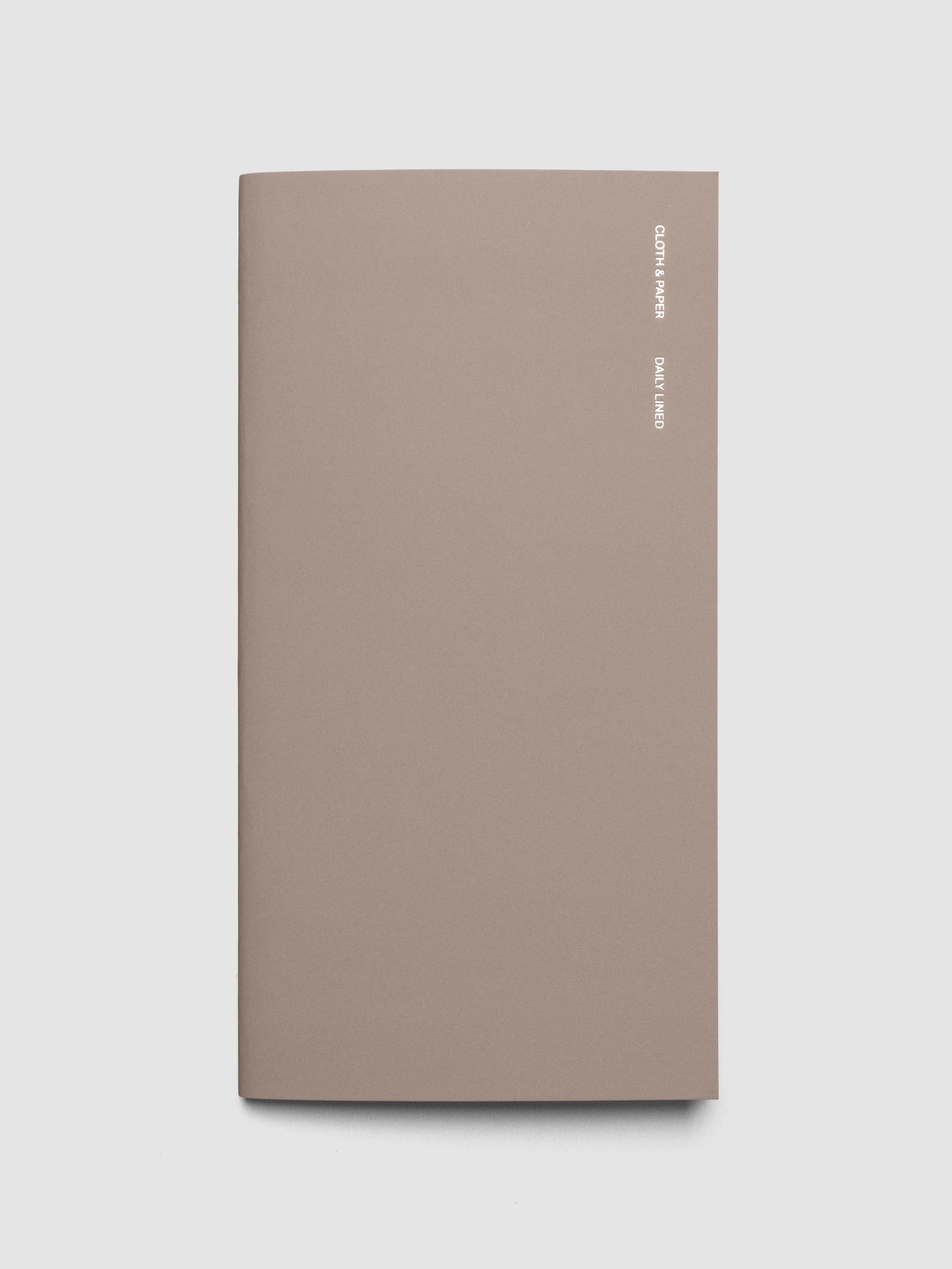 Exterior of a beige a5 slim sized travel notebook.
