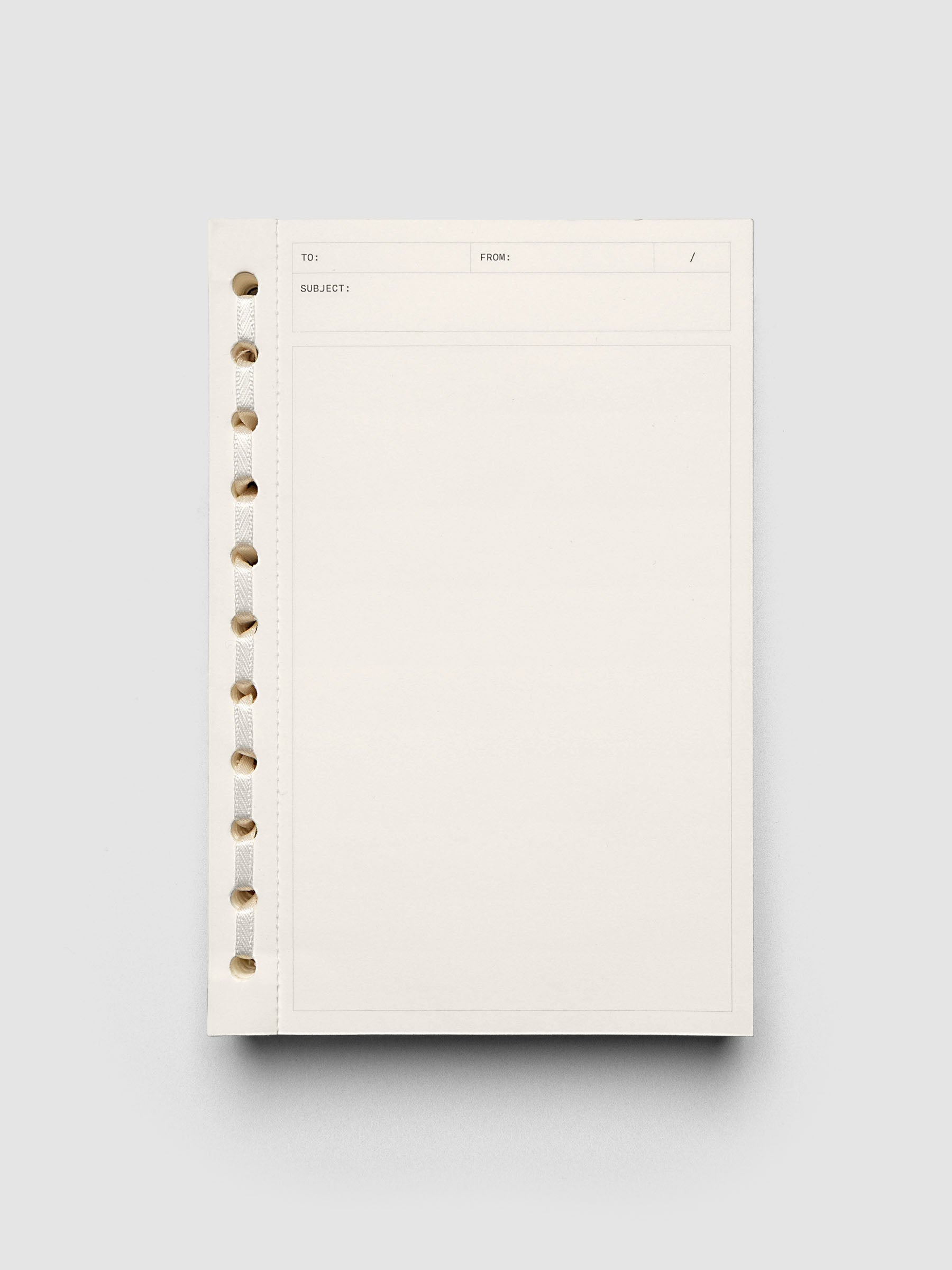 Cream paper tear away Message Pad with ribbon binding.