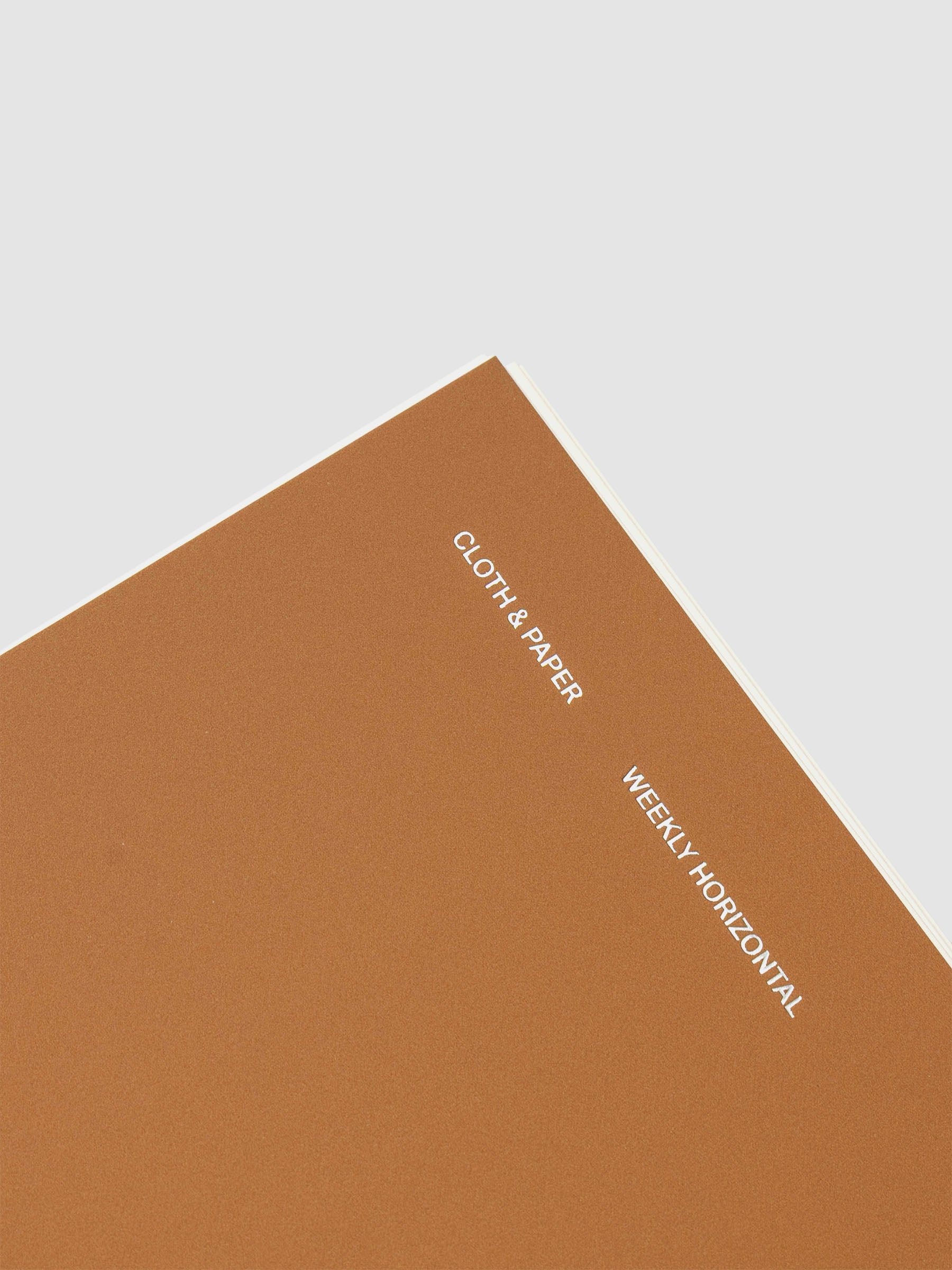 Spiral Notebook in size HP Classic and color Moscow (orange) shown close up displaying cover foil details.