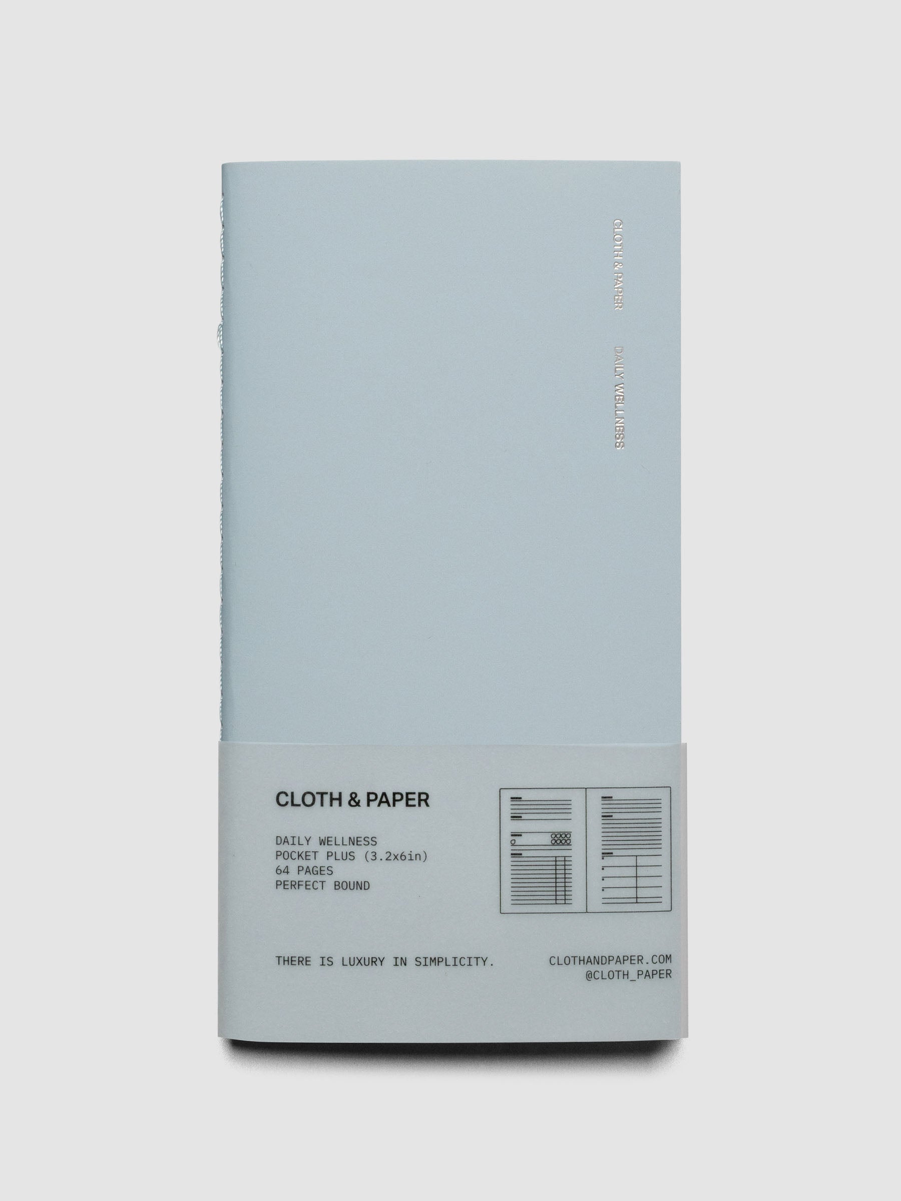 Travel Notebook in size Pocket Plus in color Smoked Salt (blue) with Daily Wellness pages shown closed in packaging.