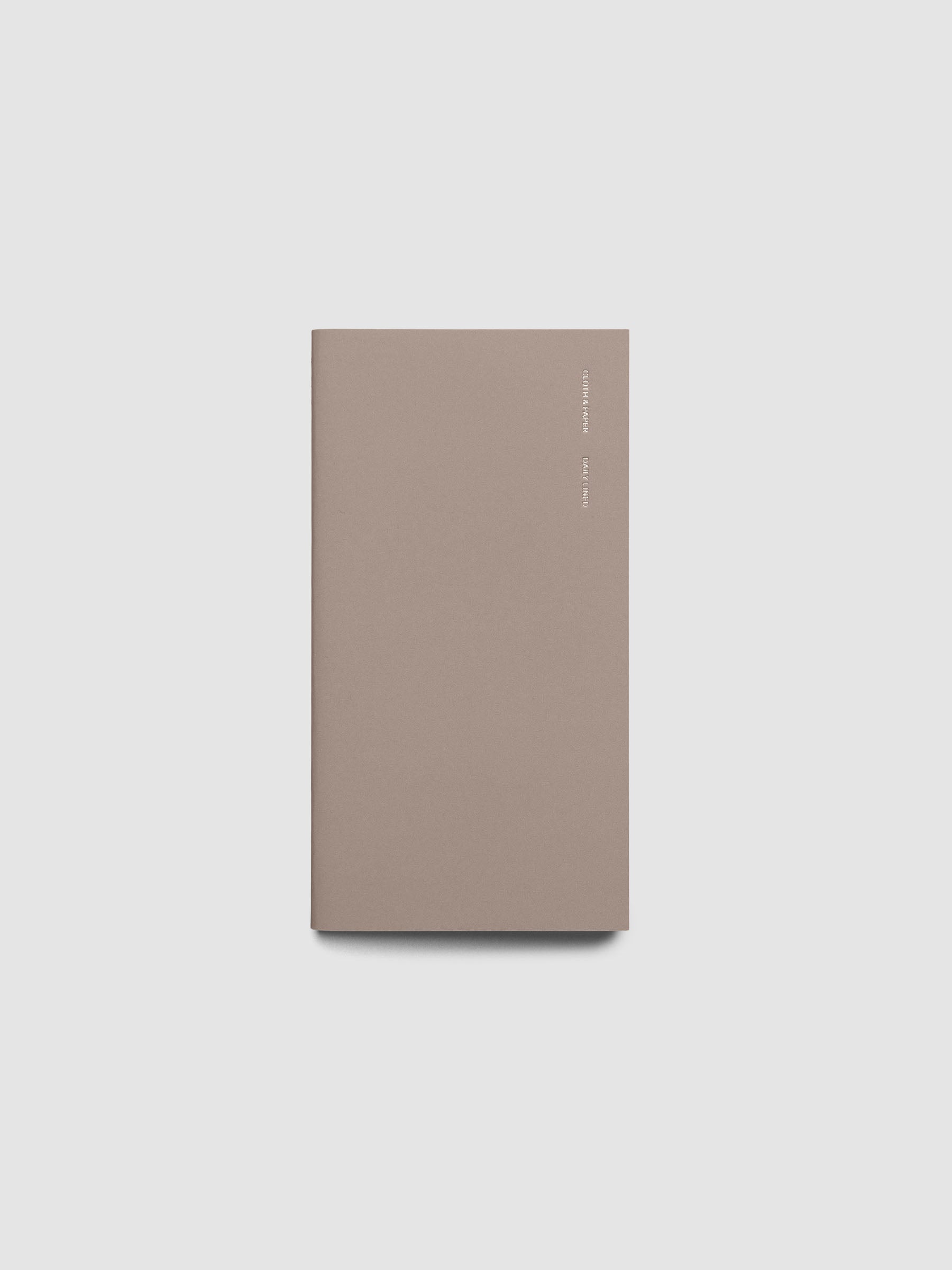 Exterior of a beige pocket plus sized travel notebook.