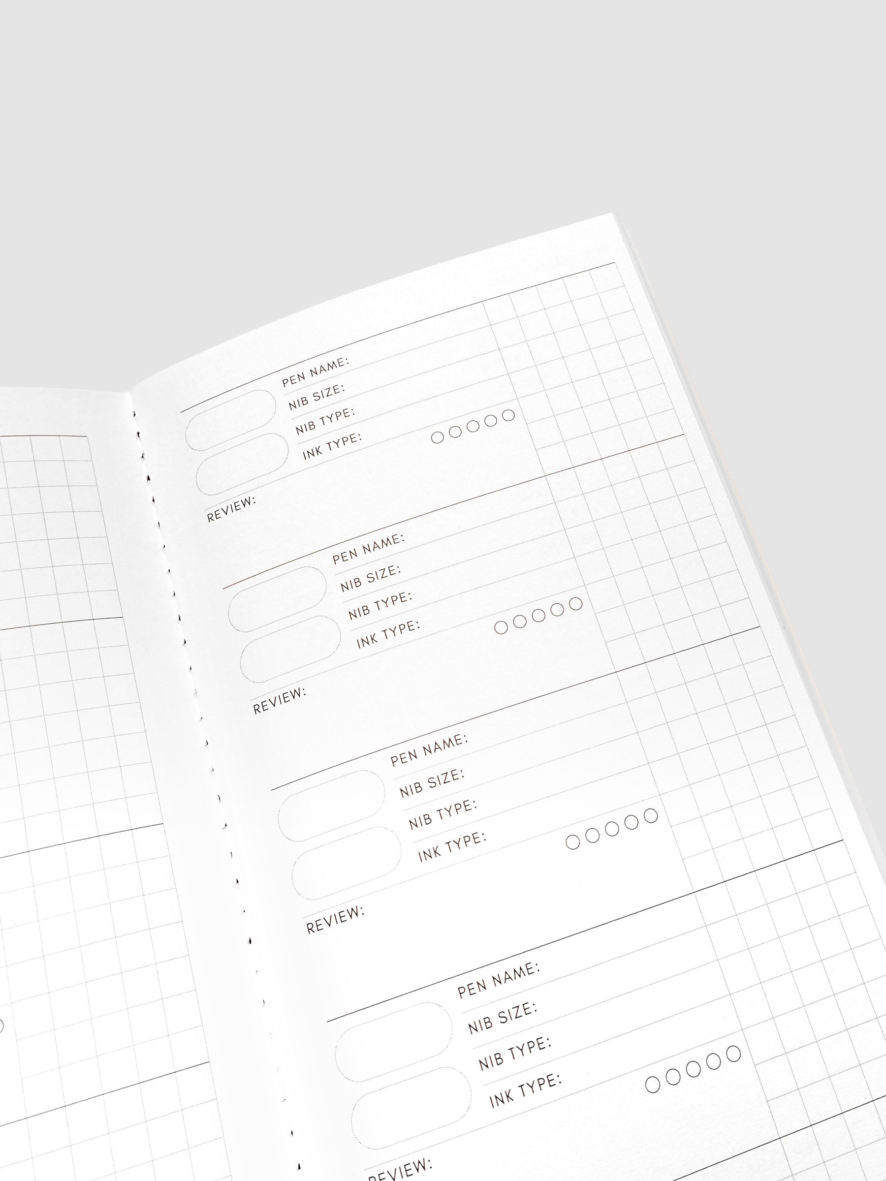 Travel Notebook Pen Swatch A5 Slim in Merlot, close up angled view of interior swatch fields with grid paper