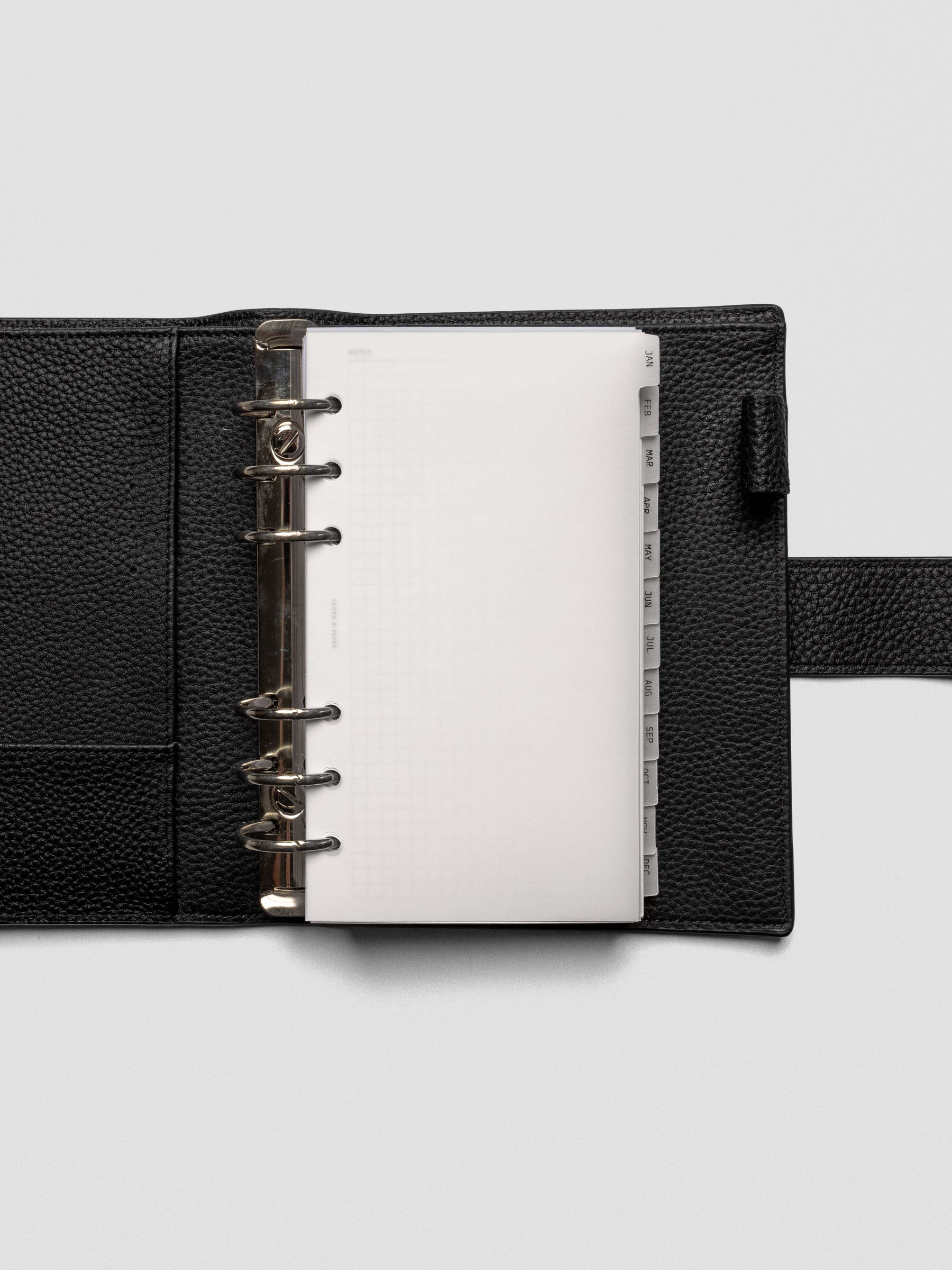 Personal vellum dividers shown bound with rings in an agenda.