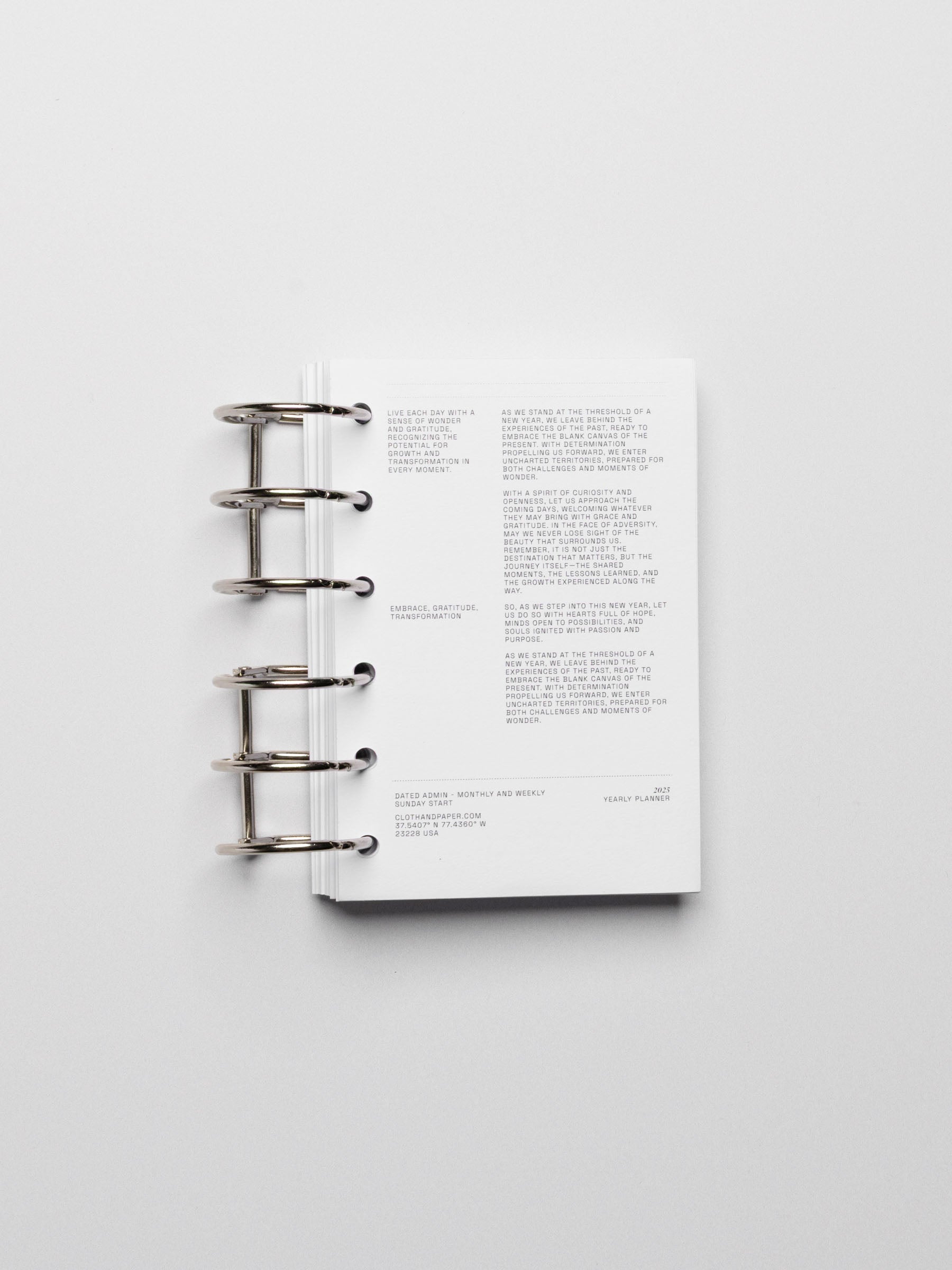 Planner rings displayed in a planner on a neutral background. Color shown is black.