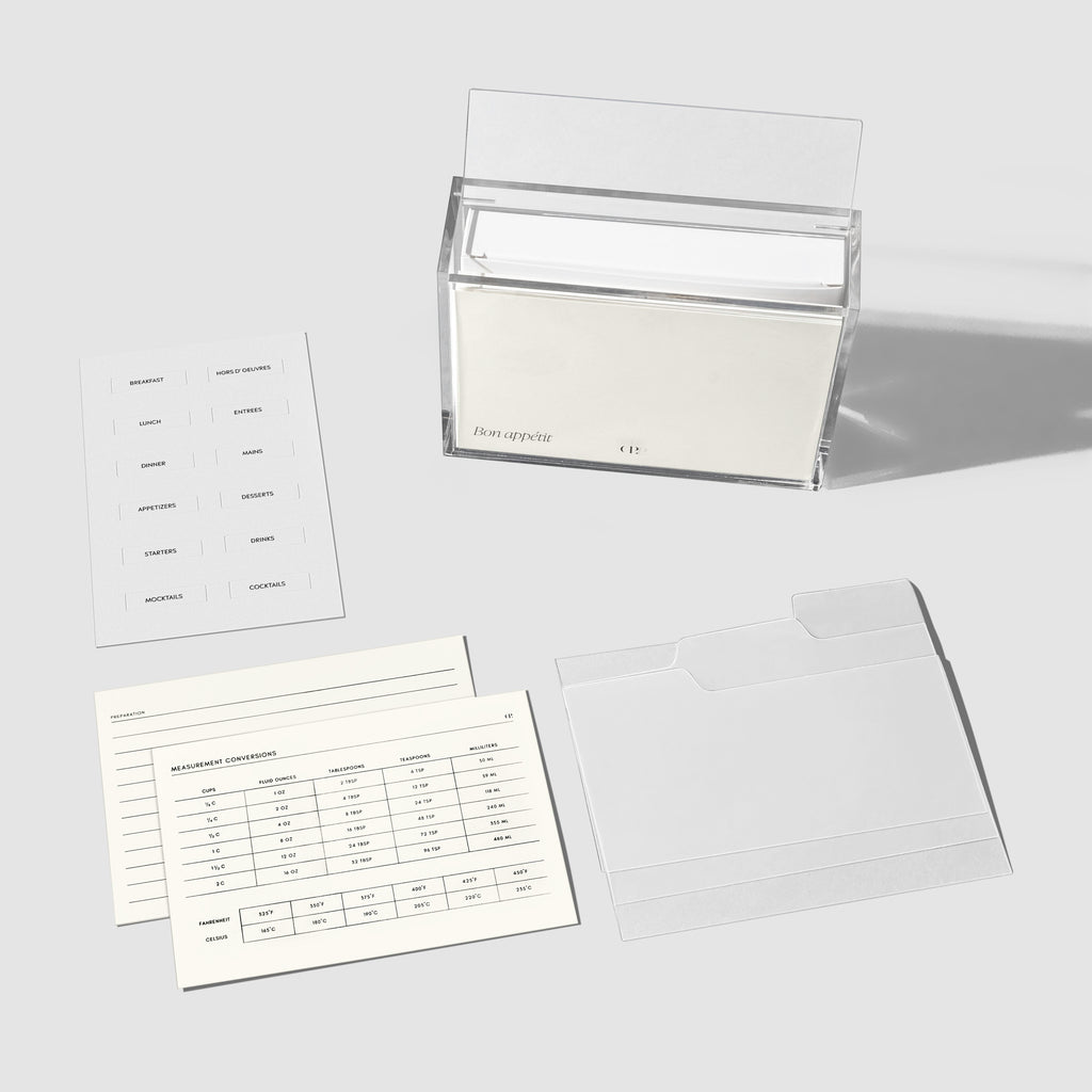 Recipe storage box, two recipe cards, three dividers, and one set of label stickers displayed on a gray background.