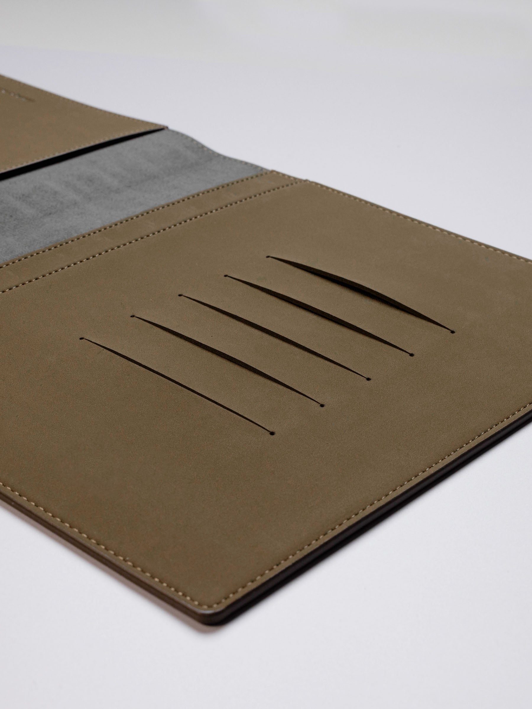 Cipher folio displayed on a neutral background. Emphasis is placed on its credit card slots.