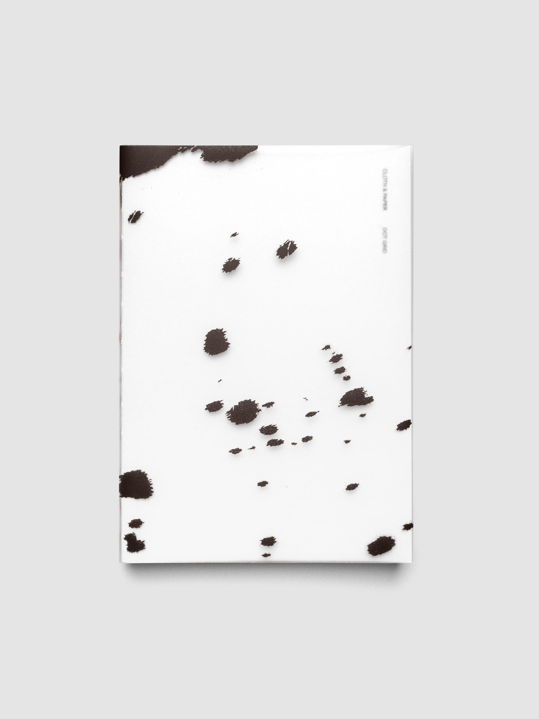 A5 frosted plastic notebook cover with brown dalmatian animal print pattern on a Perfect Bound Notebook