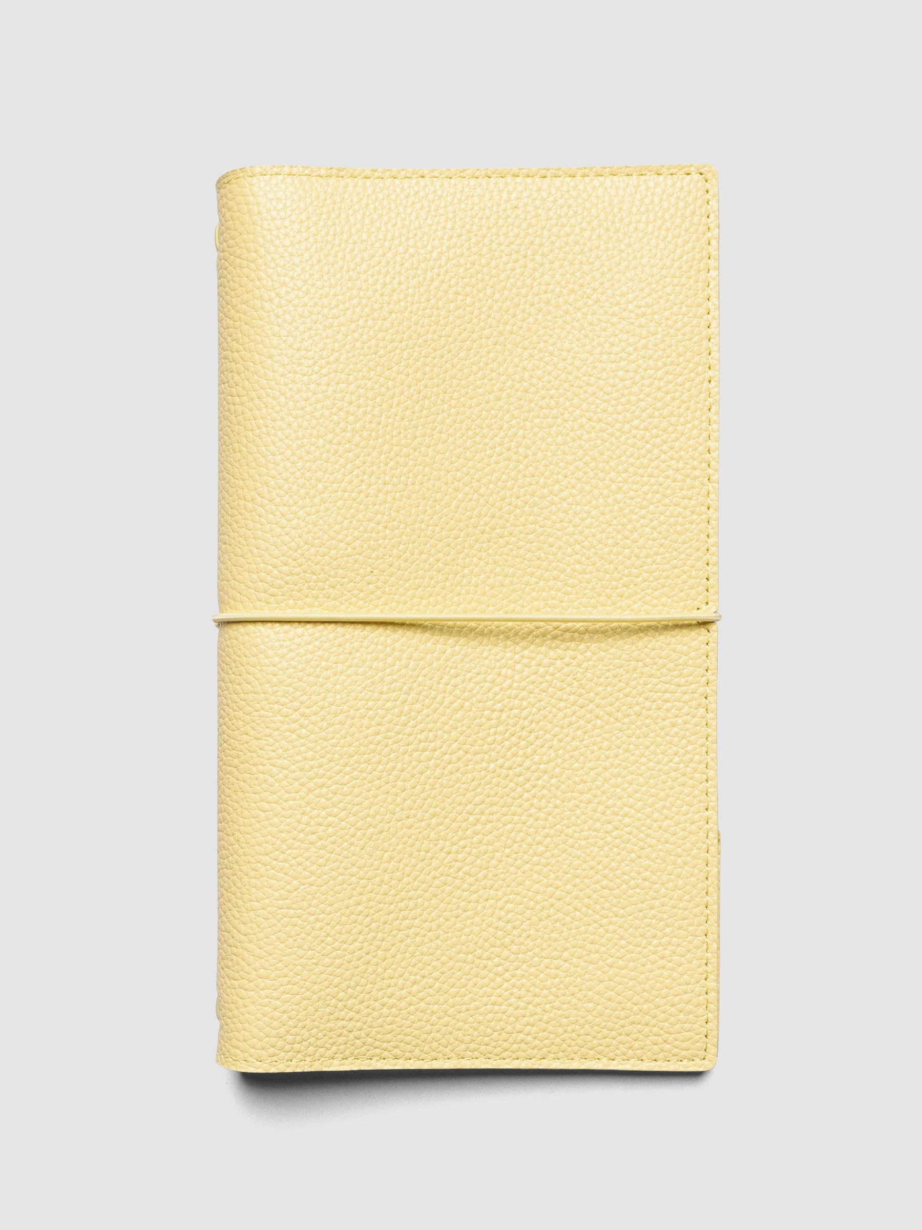 Butter yellow genuine leather travel notebook cover shown in size A5 Slim.