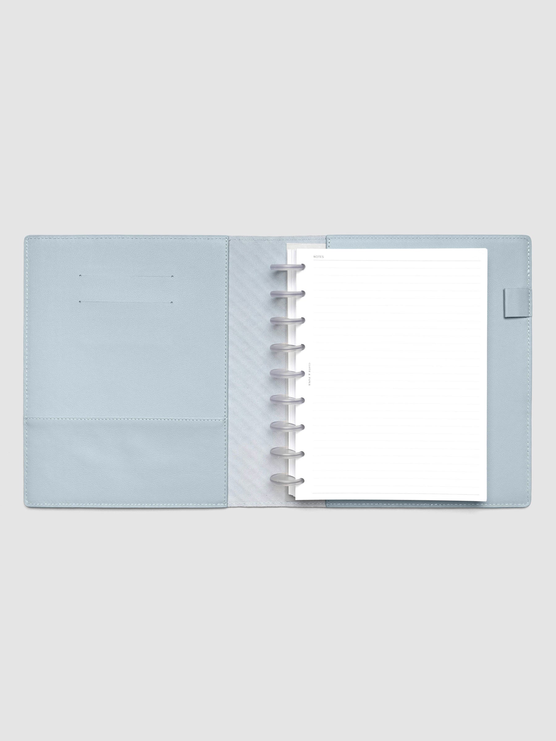 Blue leather planner folio with an HP Classic discbound planner inside.