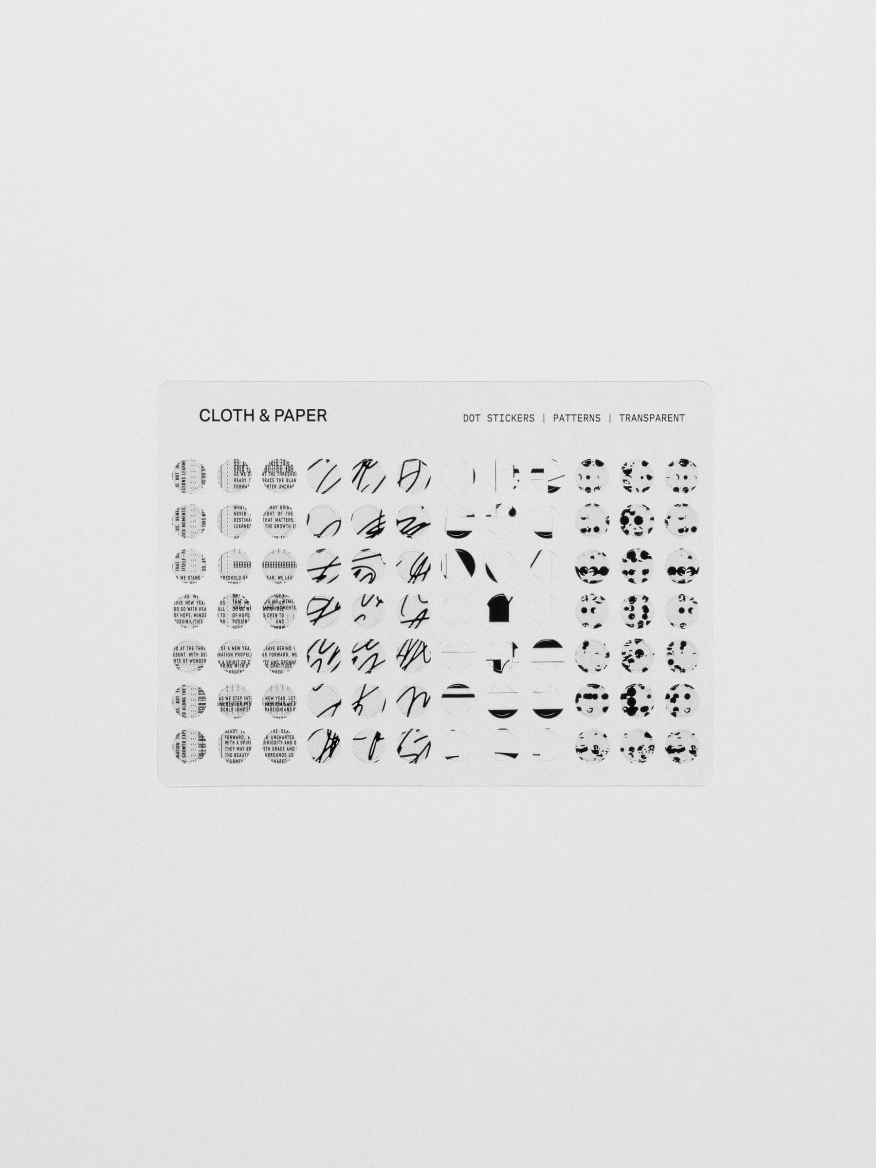 Dot stickers on a clear sheet against a neutral background