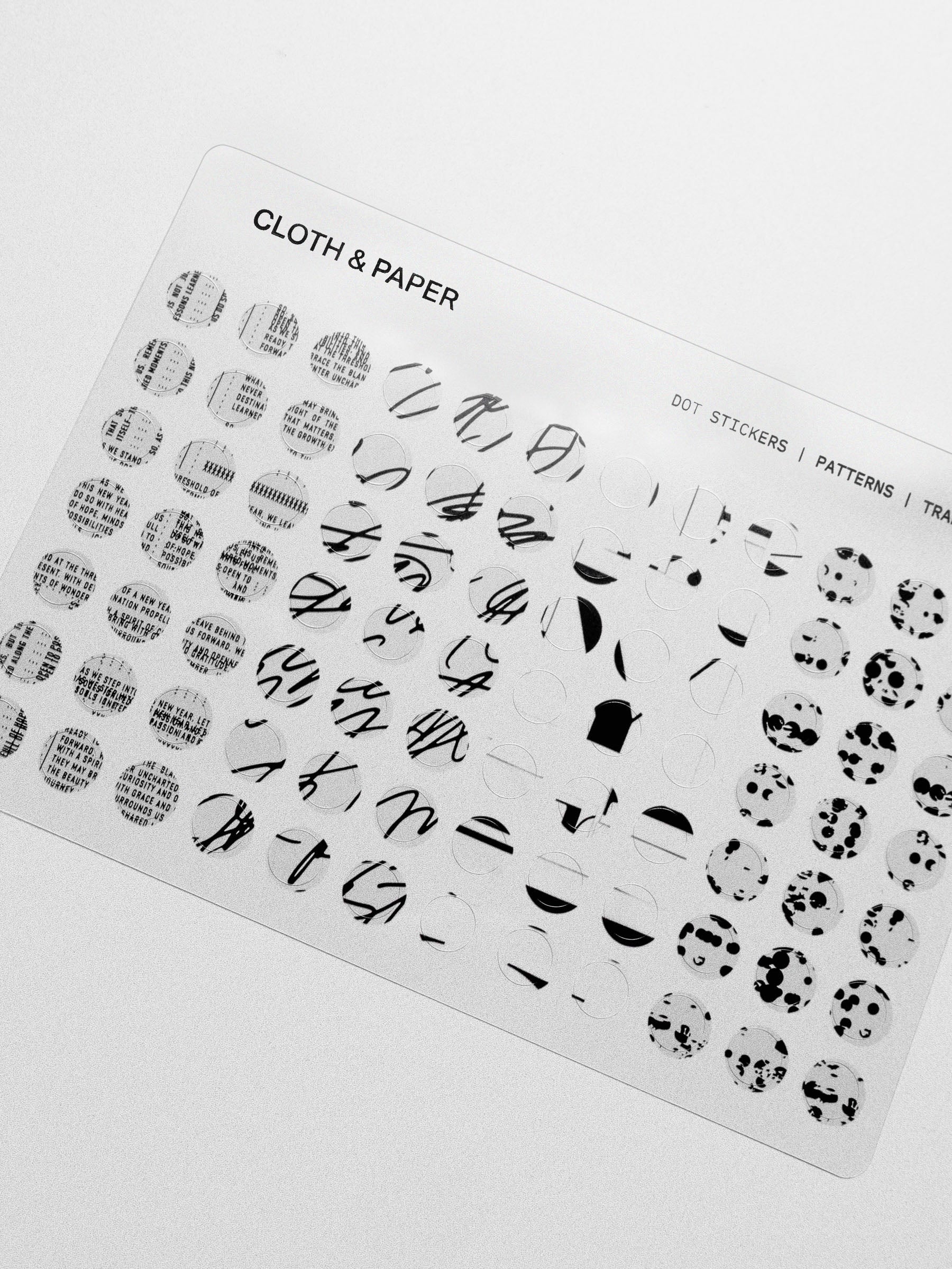 A close-up of the dot stickers on a clear sheet