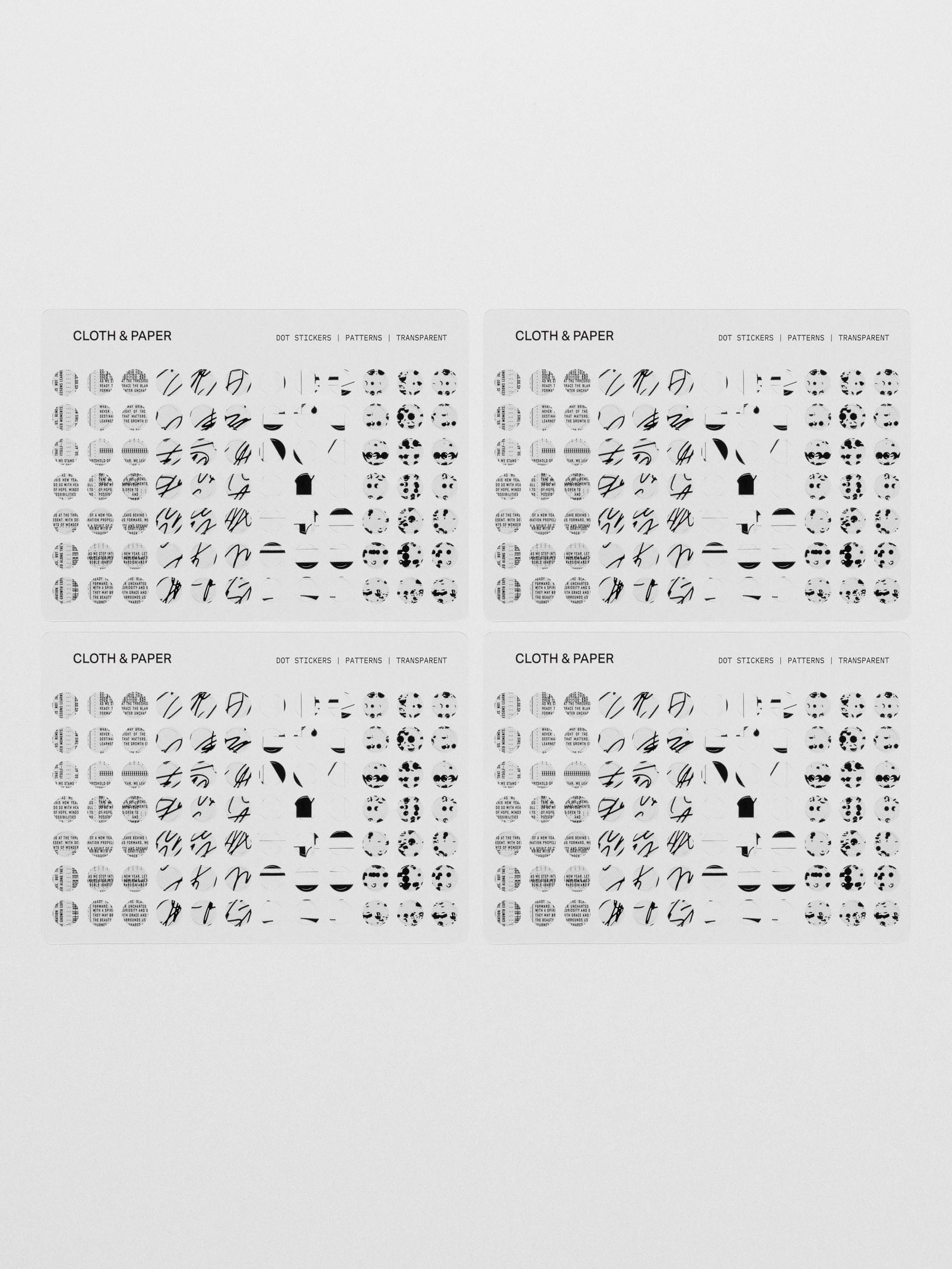 Four dot sticker sheets on a neutral background
