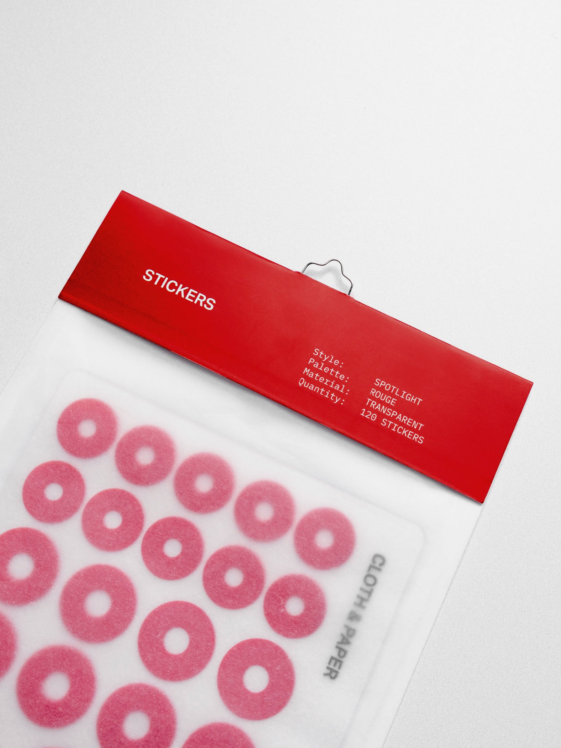 A close-up of the red spotlight stickers in its packaging