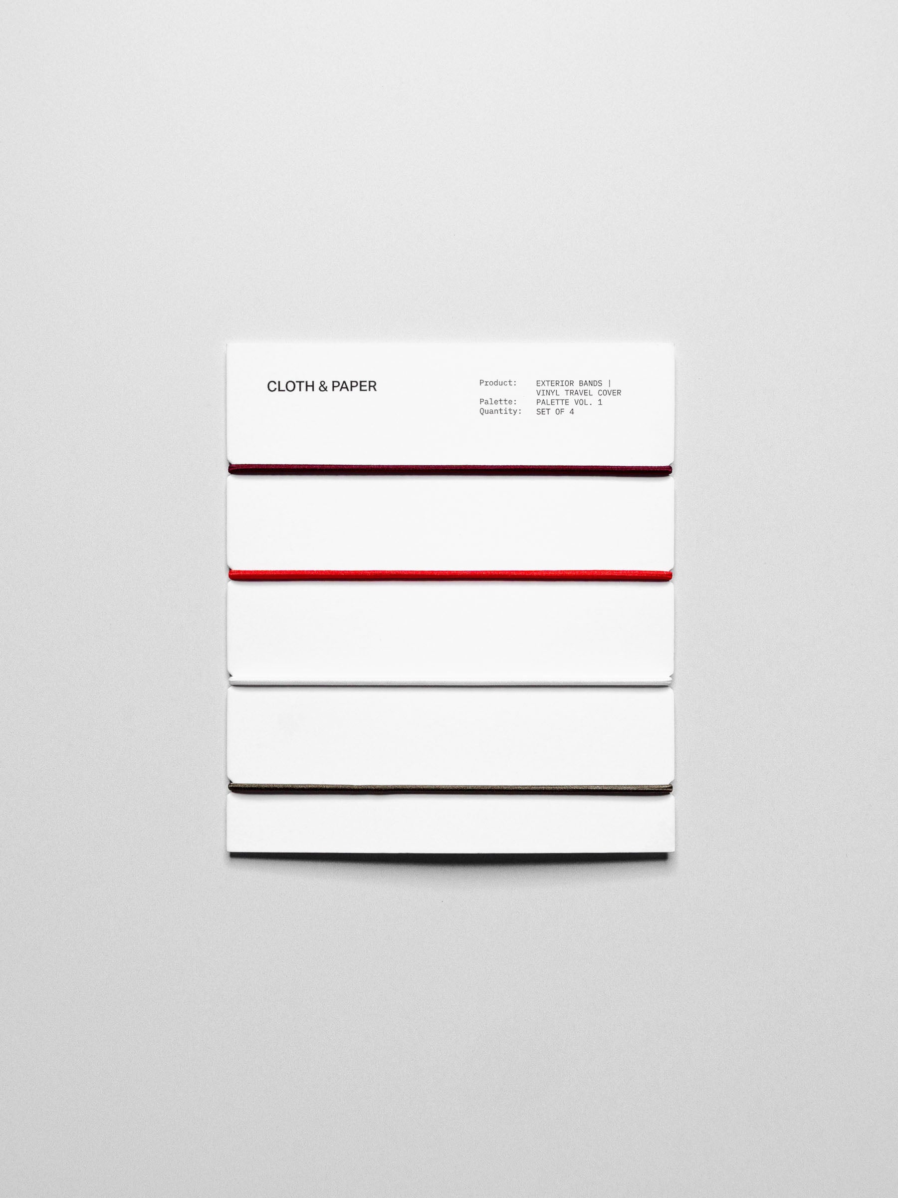 Set of travel bands displayed in their packaging on a neutral background.