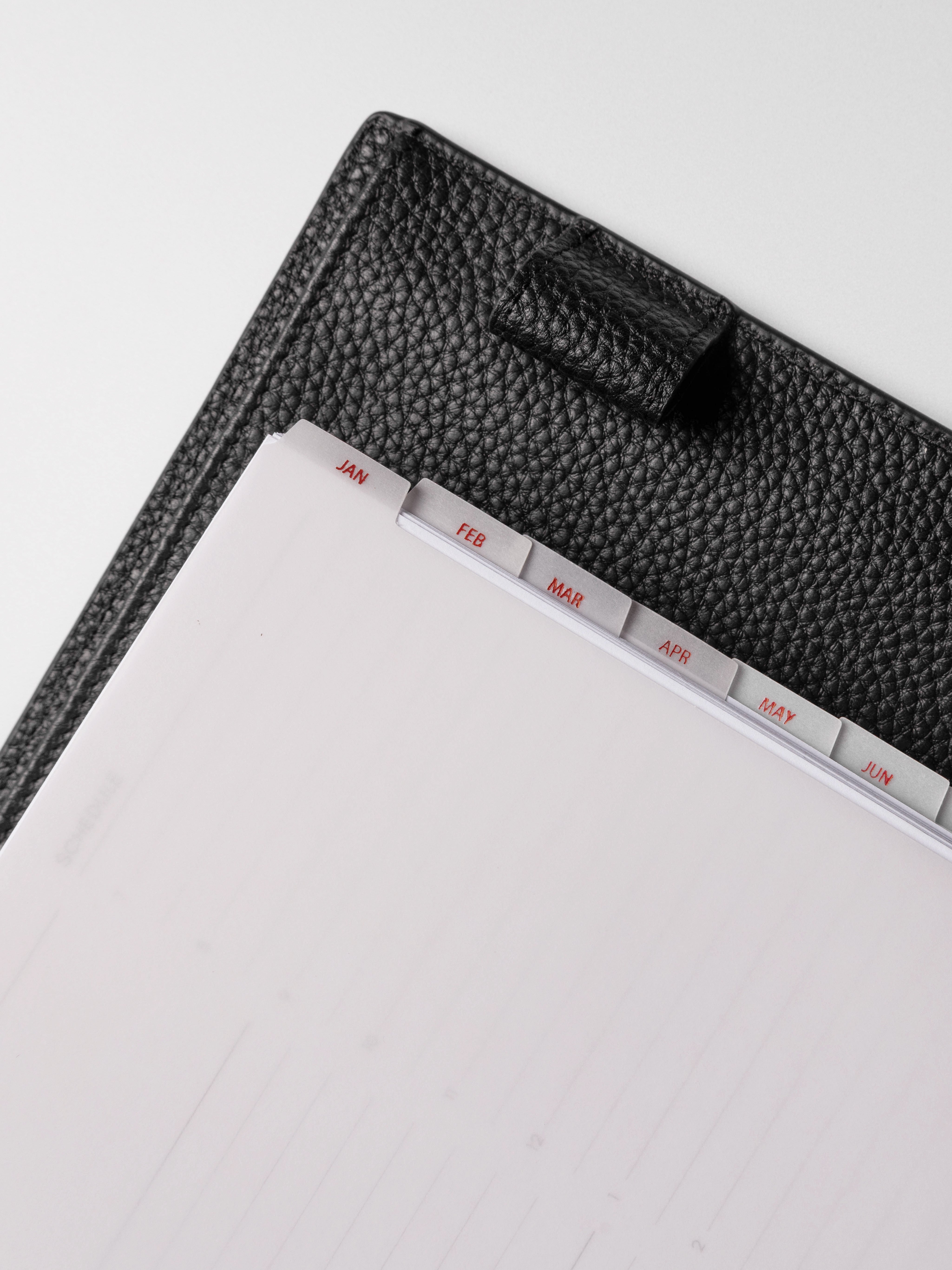 Closeup of A5 vellum dividers shown on a neutral background.