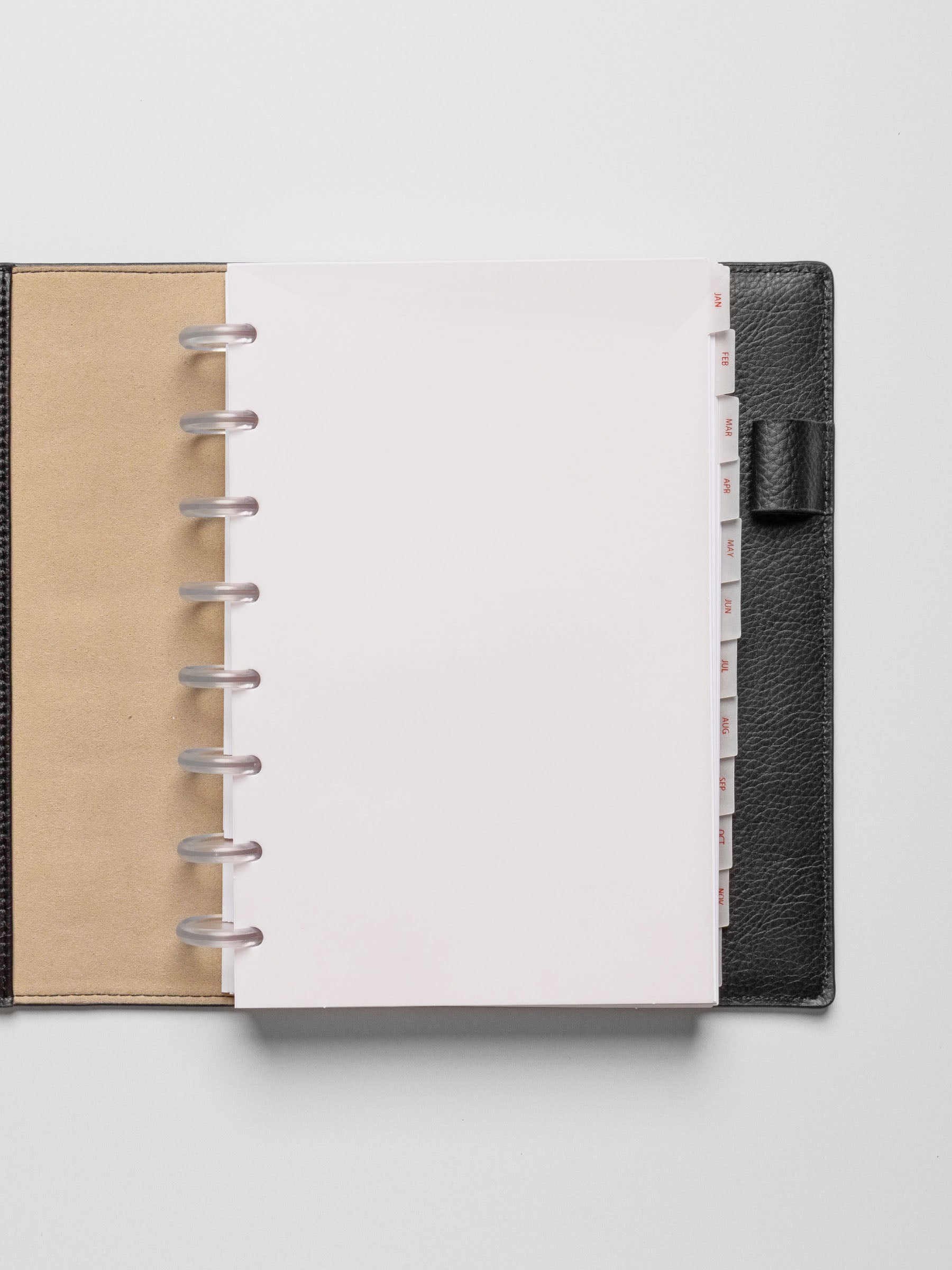 Half Letter vellum dividers shown in a black planner on a neutral background.