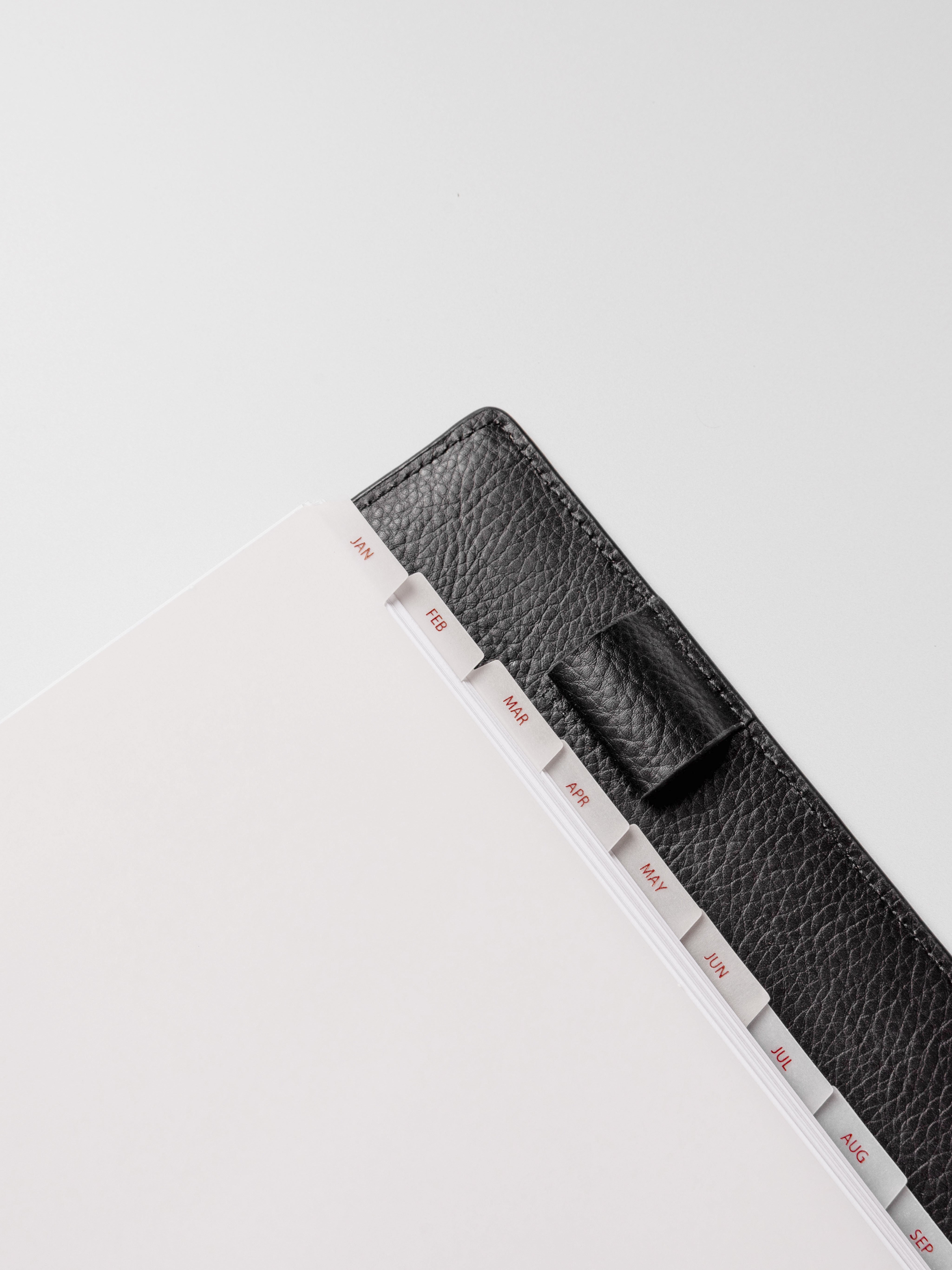 Closeup of Half Letter vellum dividers shown on a neutral background.