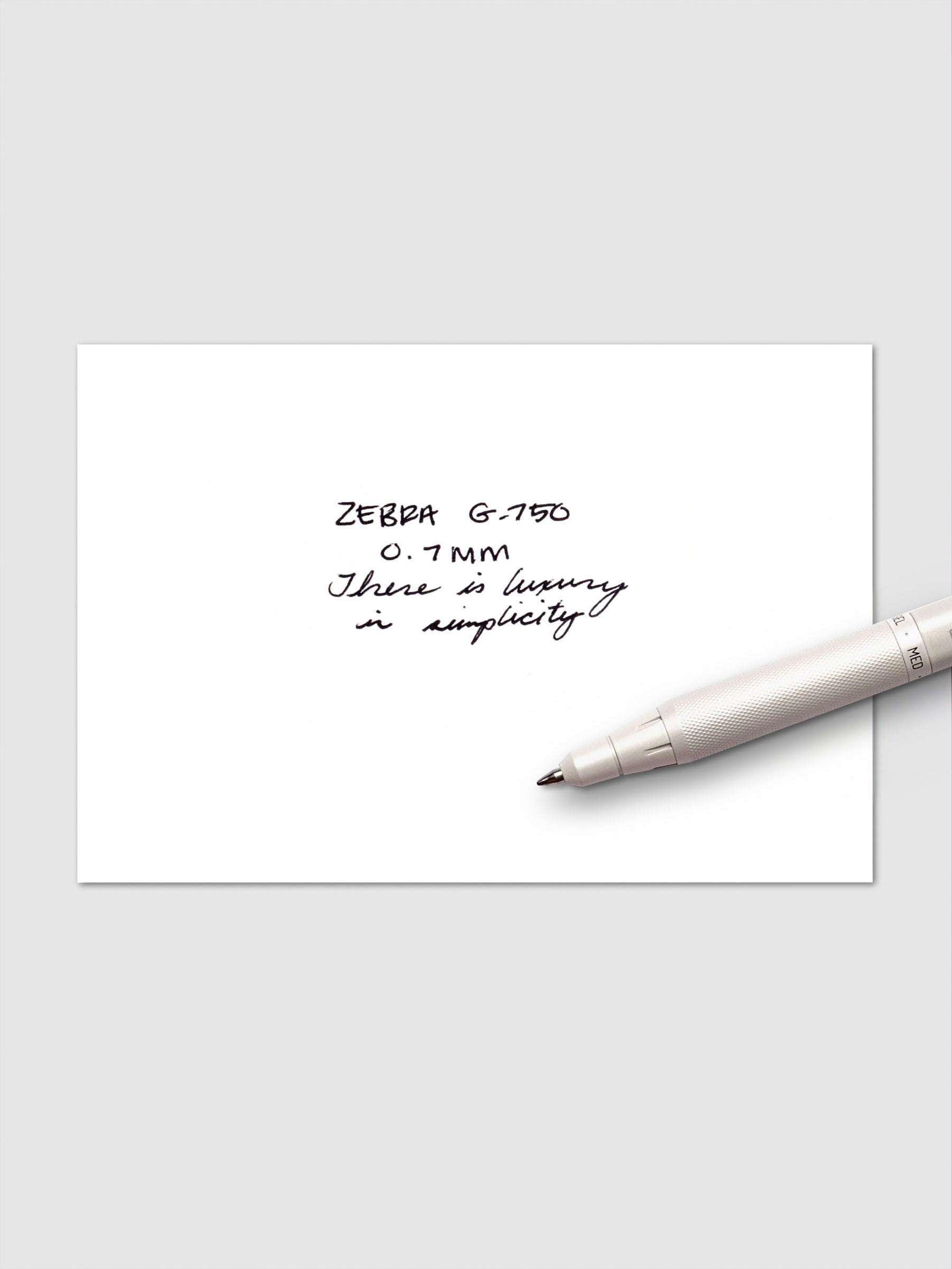 Zebra G-750 Pen displayed with a writing sample on a neutral background.