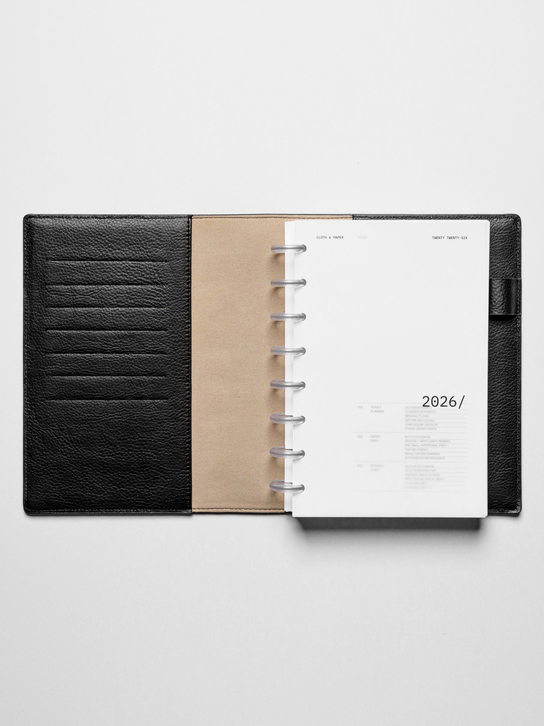 Image shows the 2026 front cover used in a black leather Half Letter disc-bound planner.