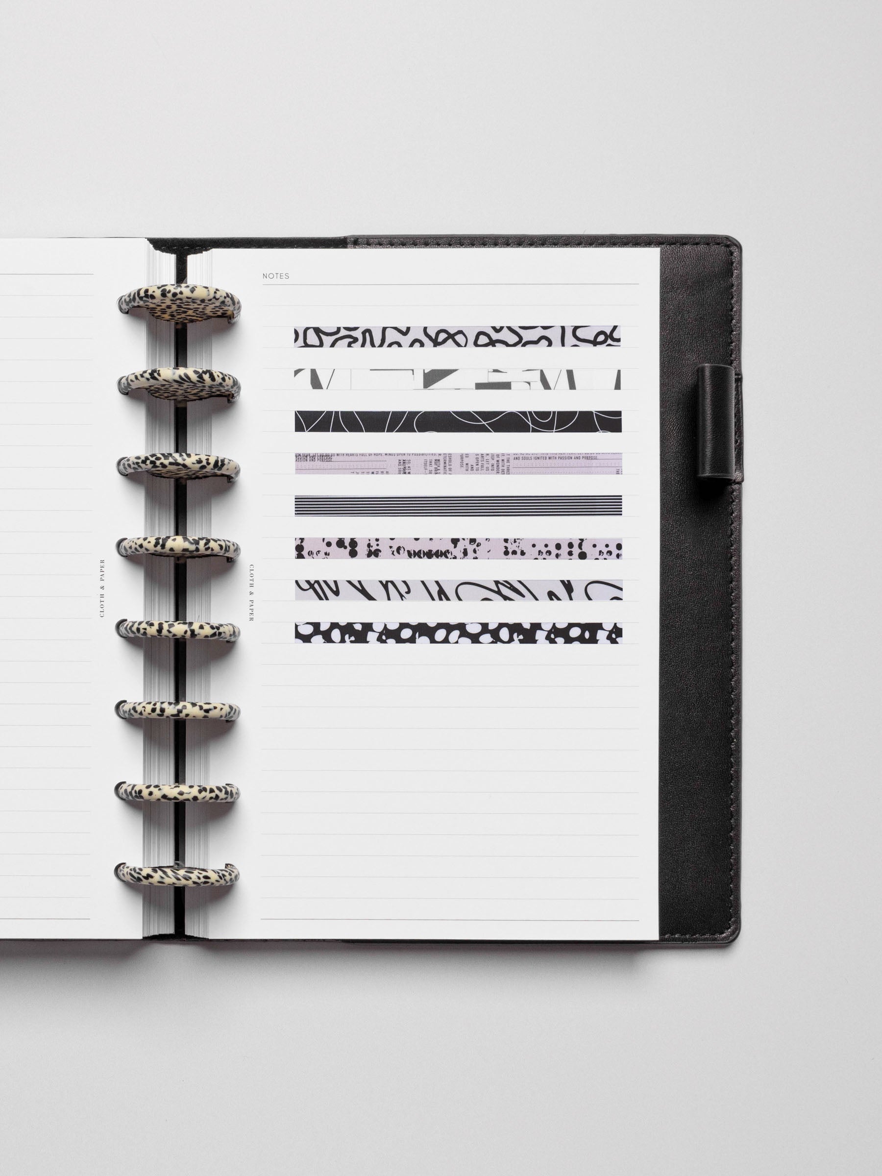 Long page pins displayed inside a discbound planner system.