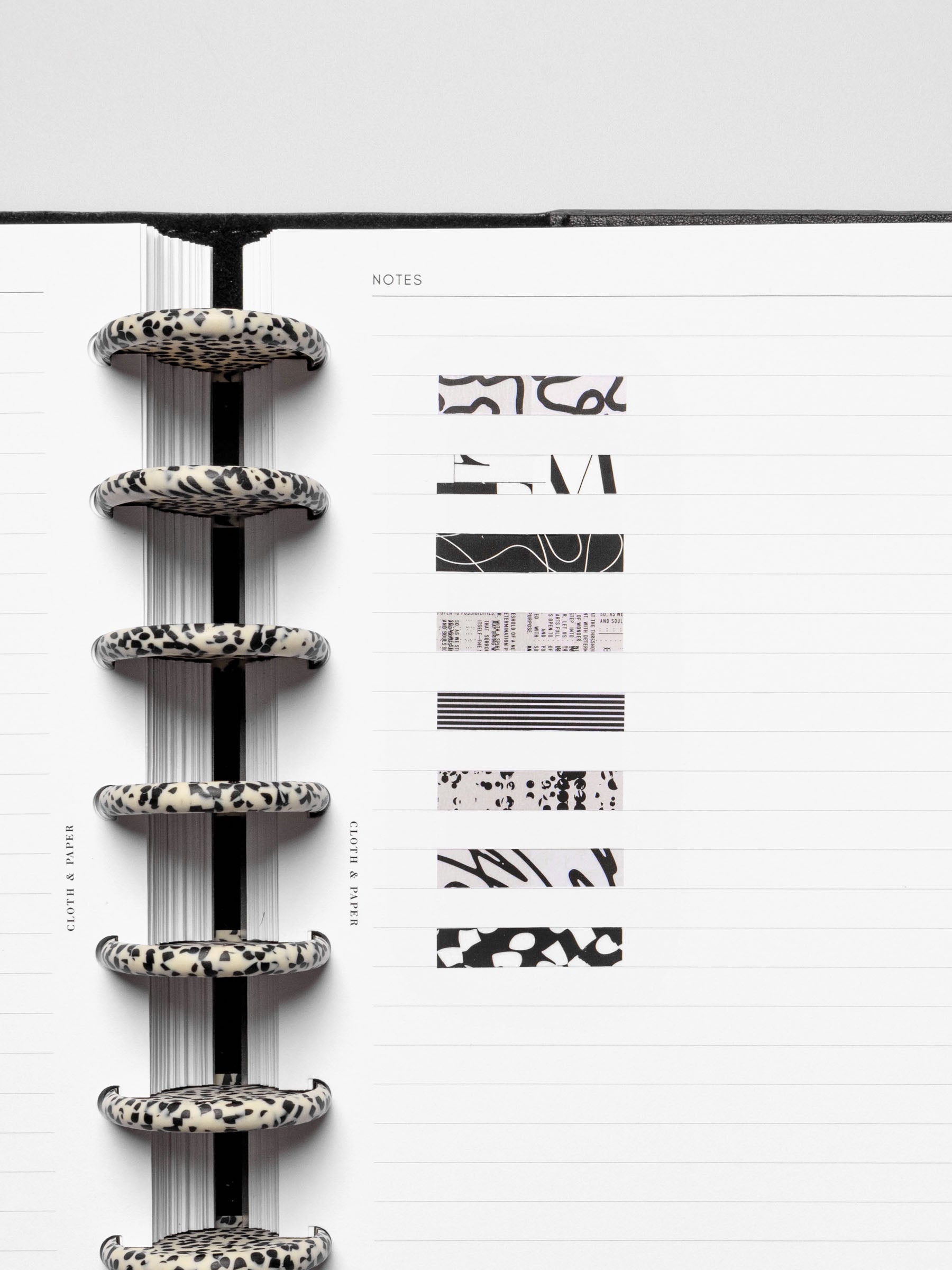 Short page pins displayed inside a discbound planner system.