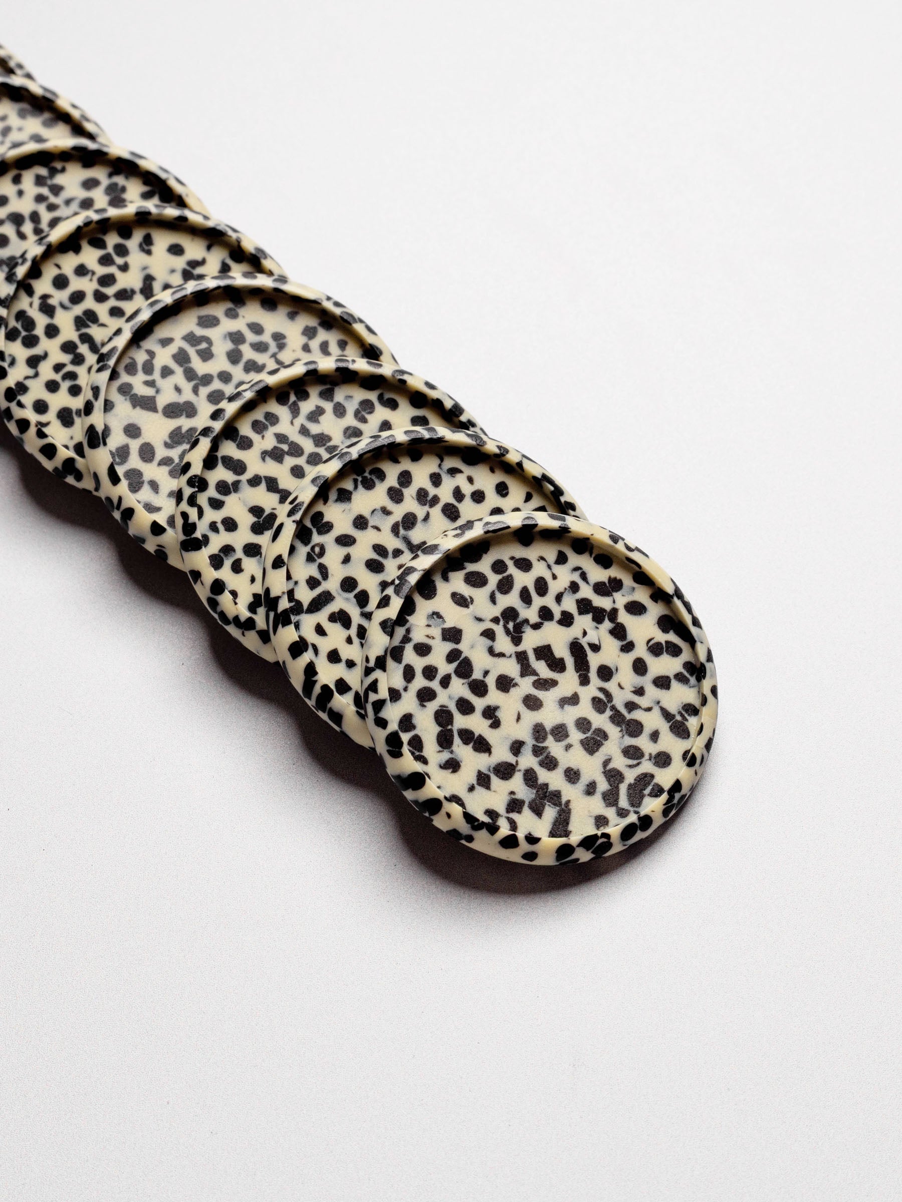 Closeup of speckled pattern on discs.