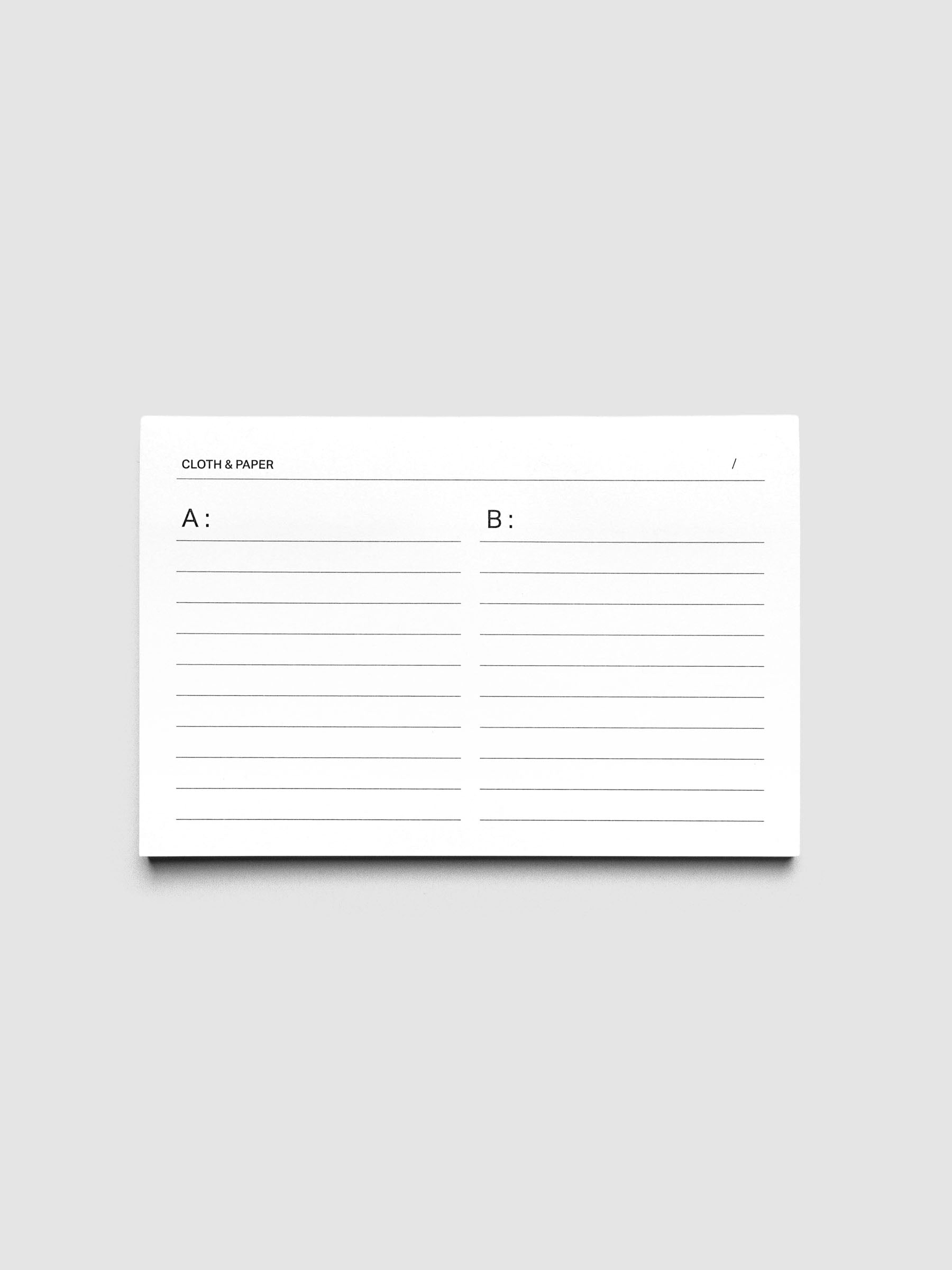 One pad of Tracklist Sticky Notes against a grey background. White sticky notes with A and B sides and lined notes sections.