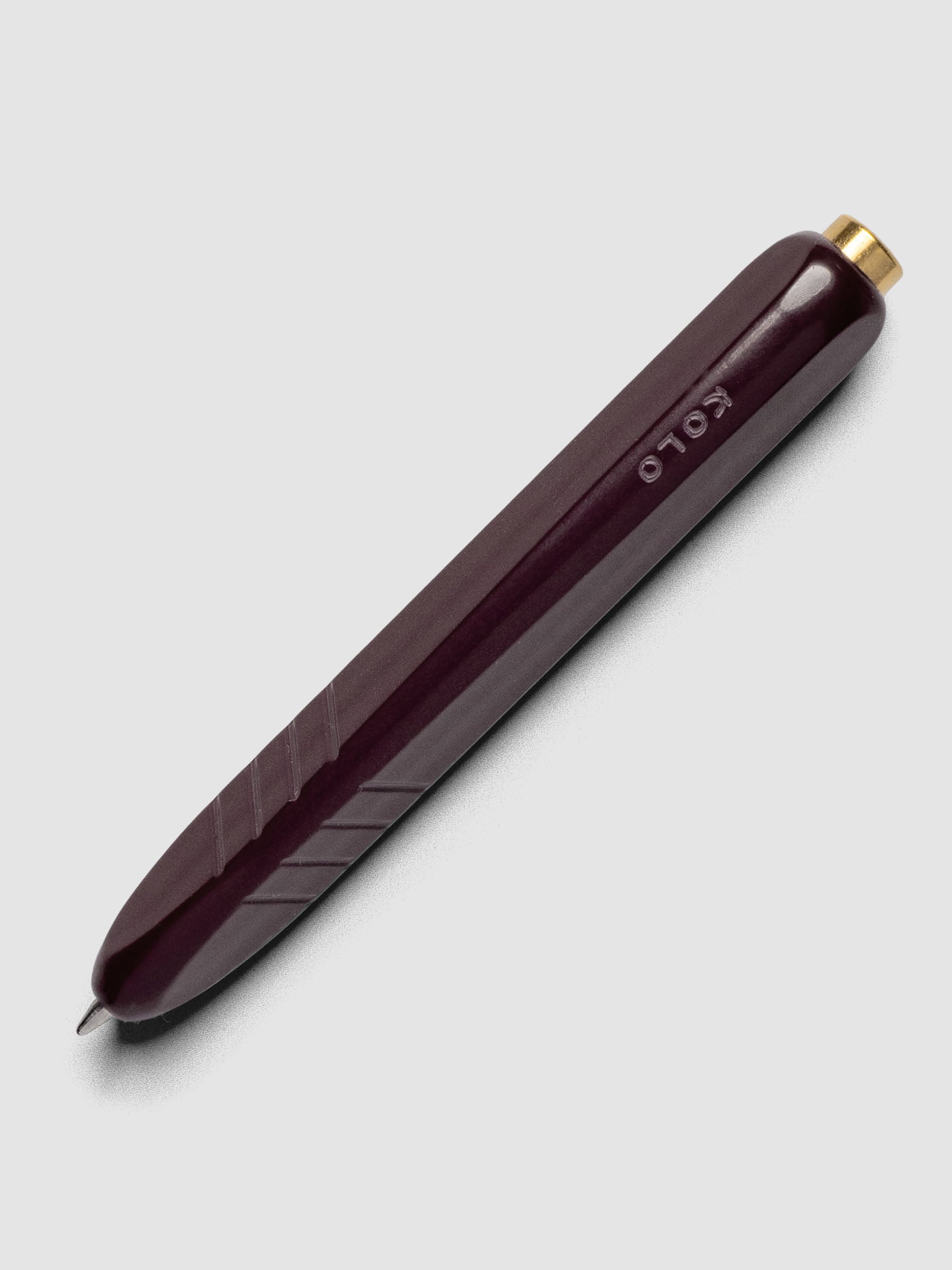 Kolo Tino Ballpoint Pen in option Acrylic Cabaret with a deep burgundy barrel.