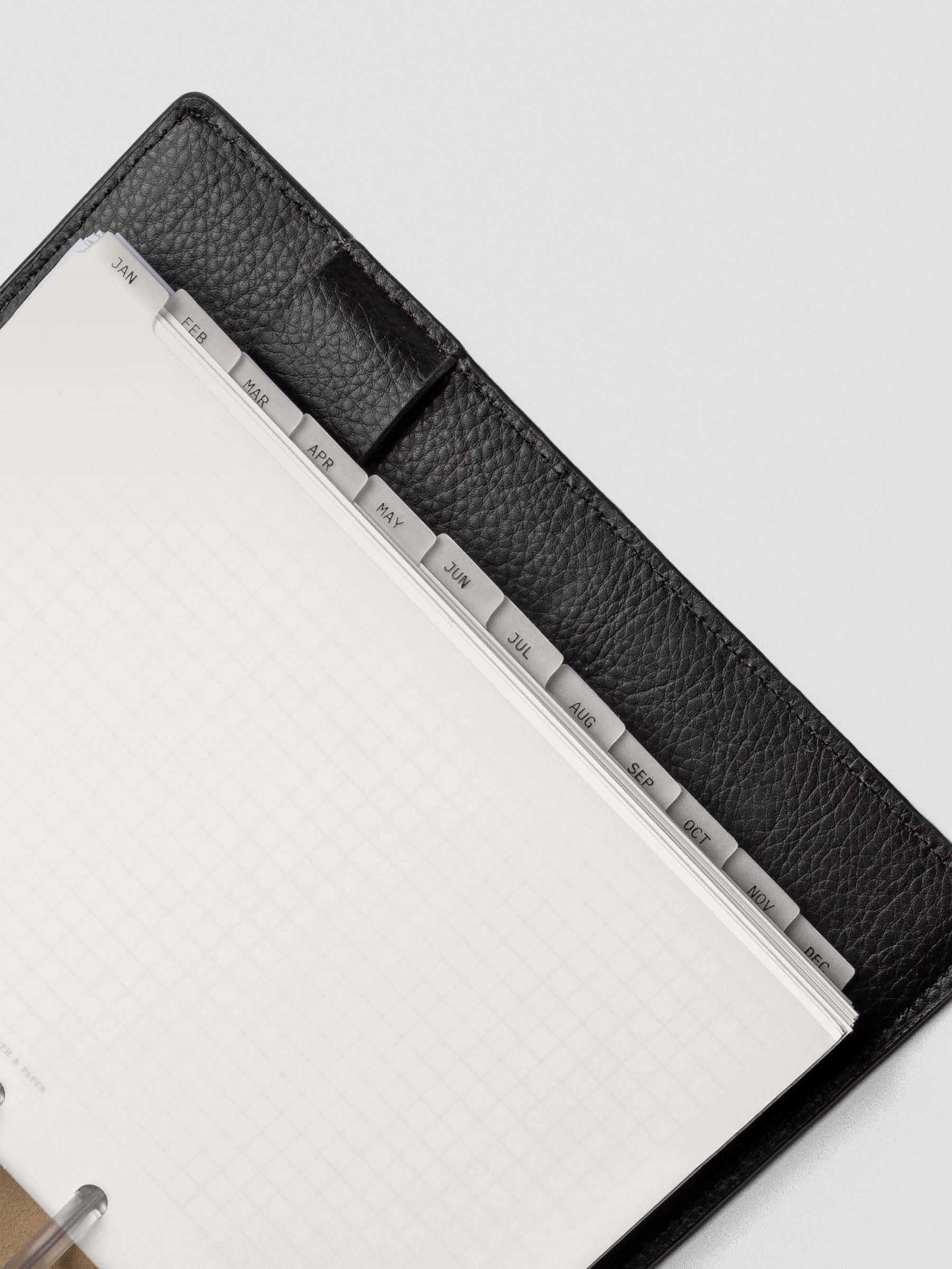 Close up of HP Mini vellum dividers shown at an angle bound with discs in a folio.