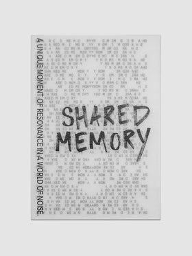 Translucent vellum journaling card with a black printed text design reading "Shared Memory".