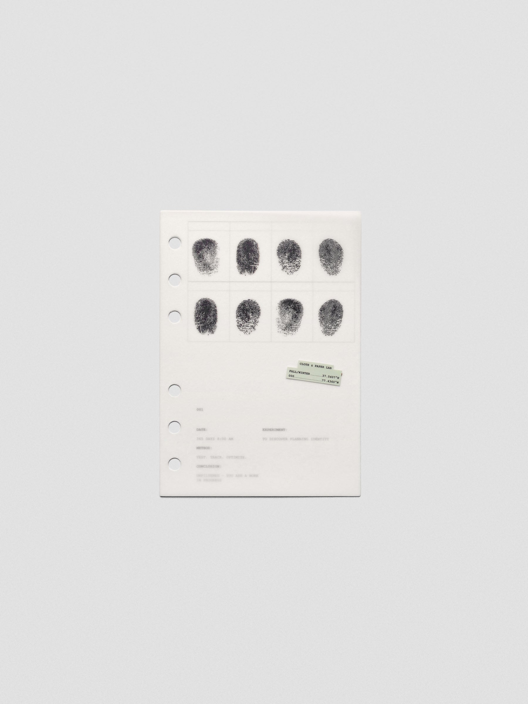 Two layered A6 sized planner dashboards, one semi-transparent, one matte, featuring a fingerprint design.