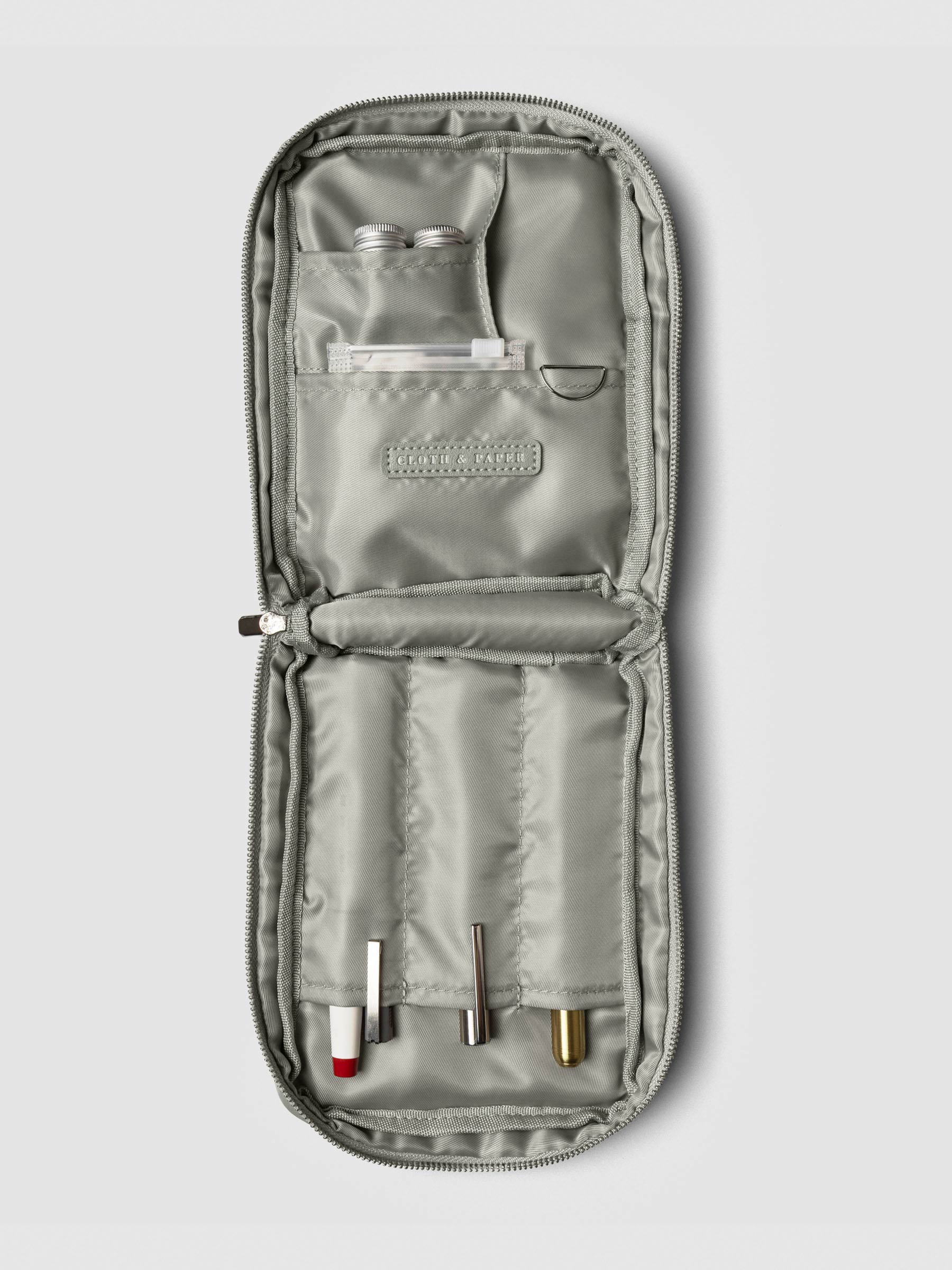 Open view of the empty Fountain Pen Travel Case | Ristretto, showing multiple stitched compartments for pens and accessories.