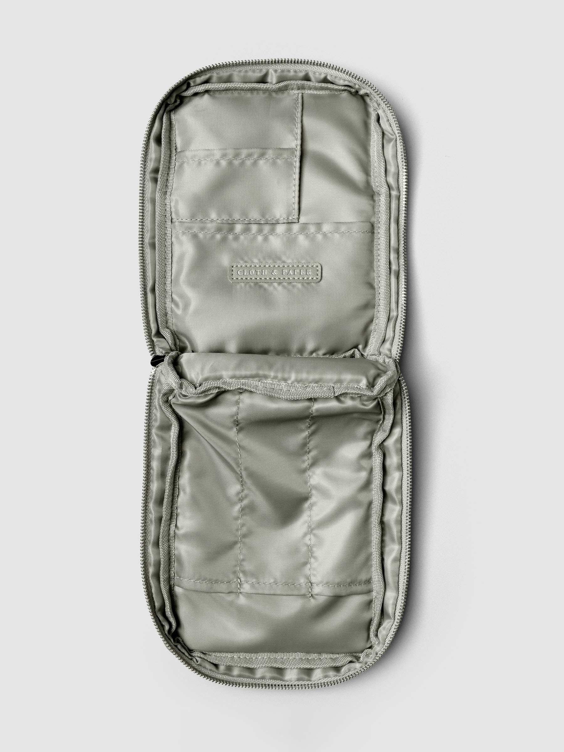 Open view of the empty Fountain Pen Travel Case | Ristretto, showing multiple stitched compartments for pens and accessories.