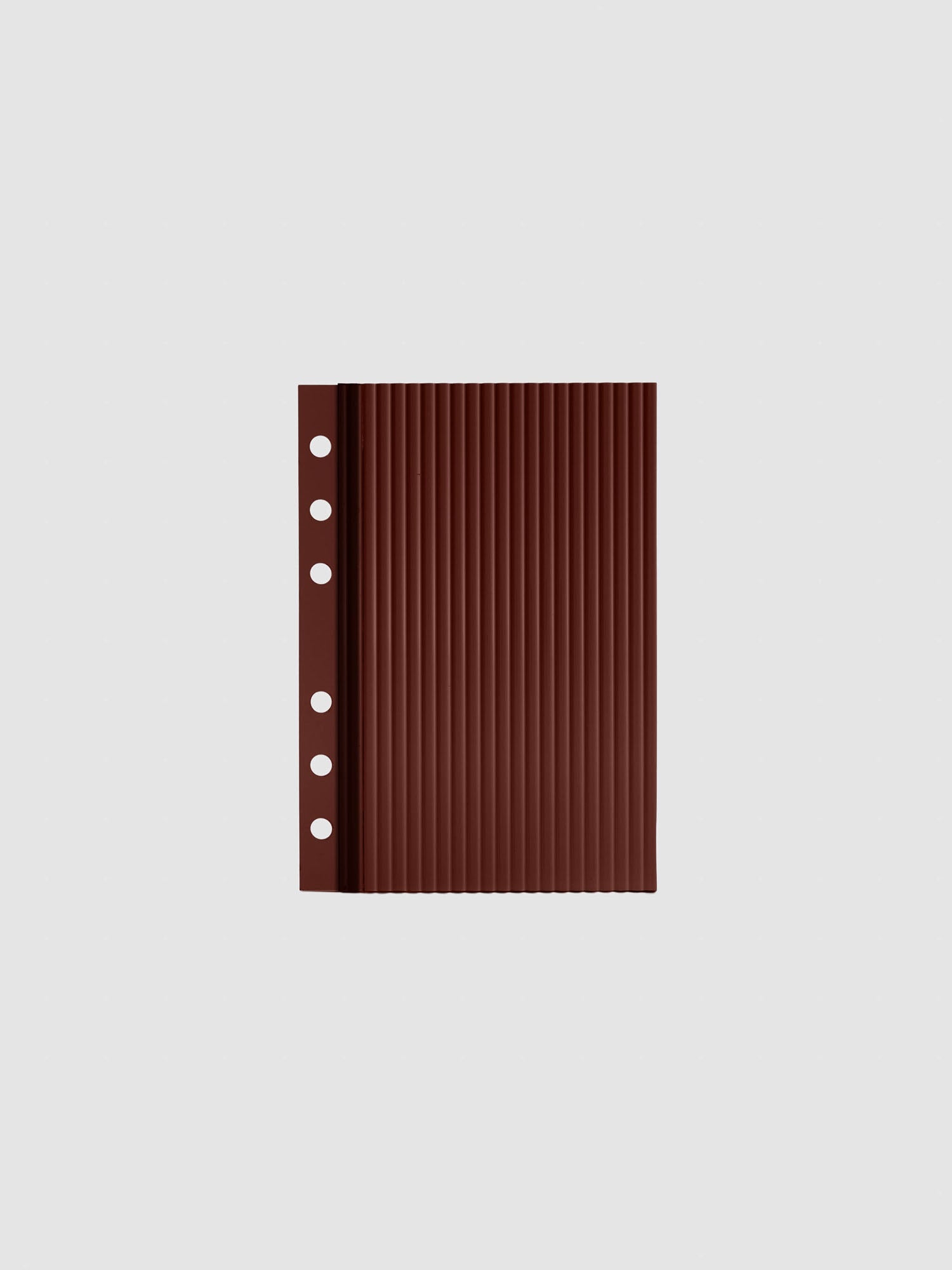 Bordeaux fluted planner dashboard in A6 size, six ring punch, shown flat on a grey background.