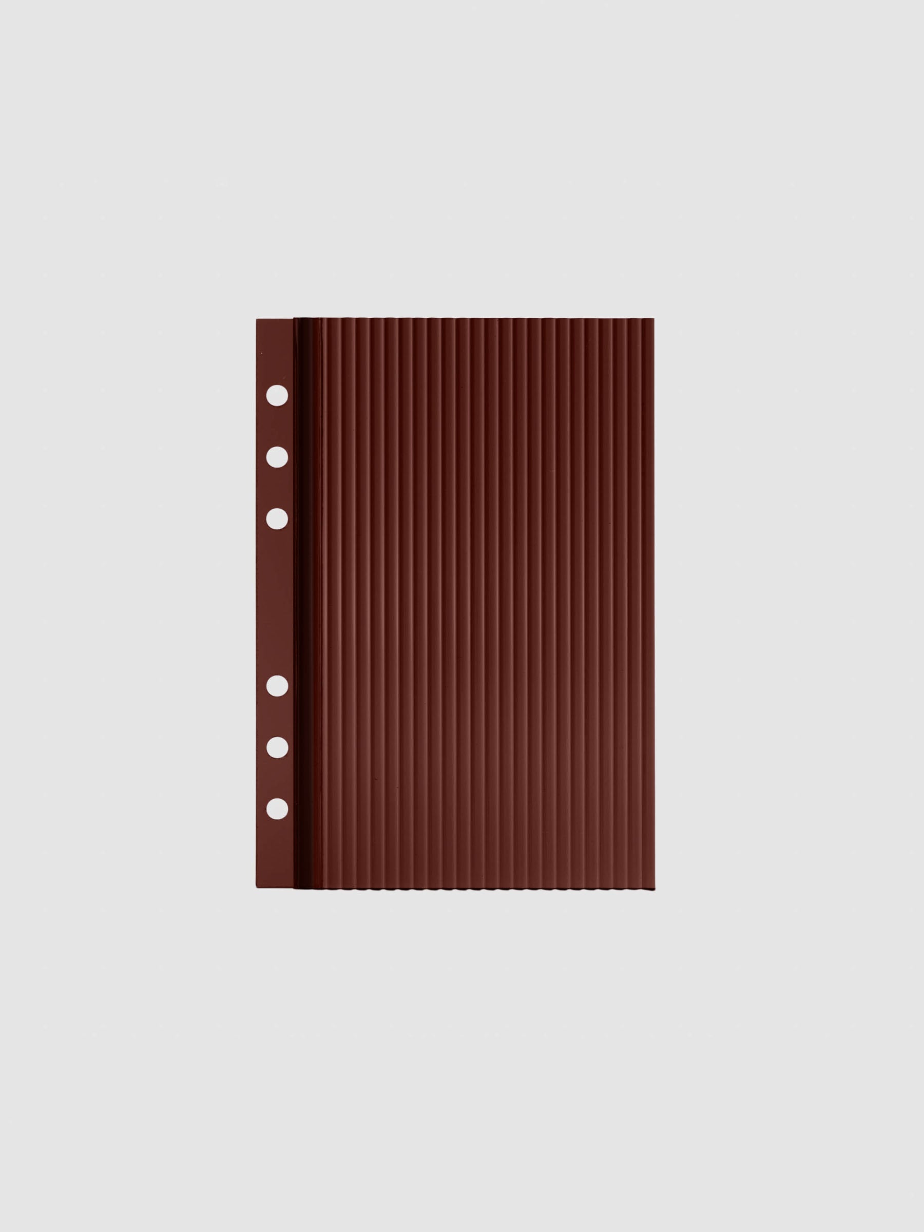 Bordeaux fluted planner dashboard in Personal Wide size, six ring punch, shown flat on a grey background.