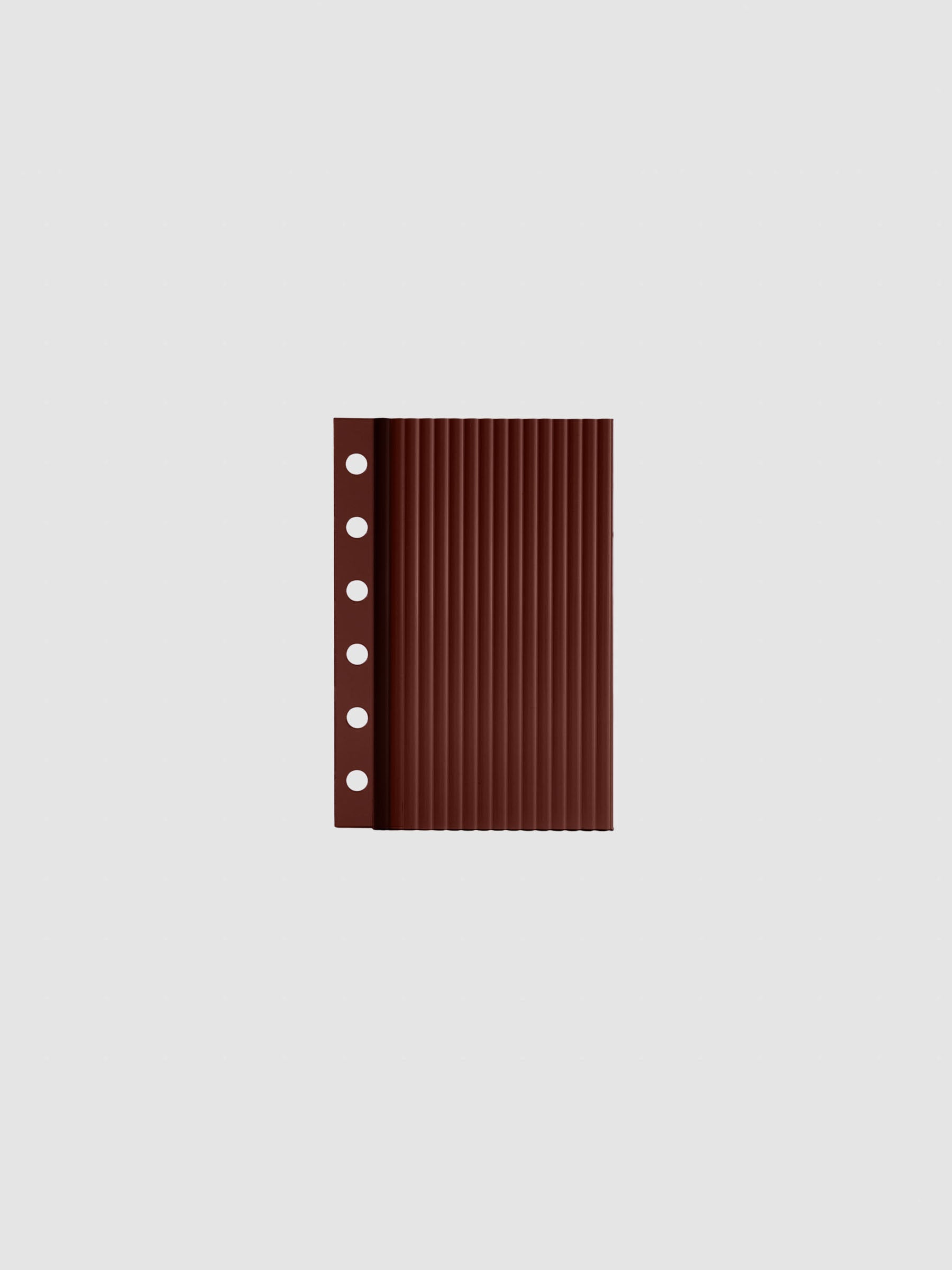 Bordeaux fluted planner dashboard in Pocket size, six ring punch, shown flat on a grey background.
