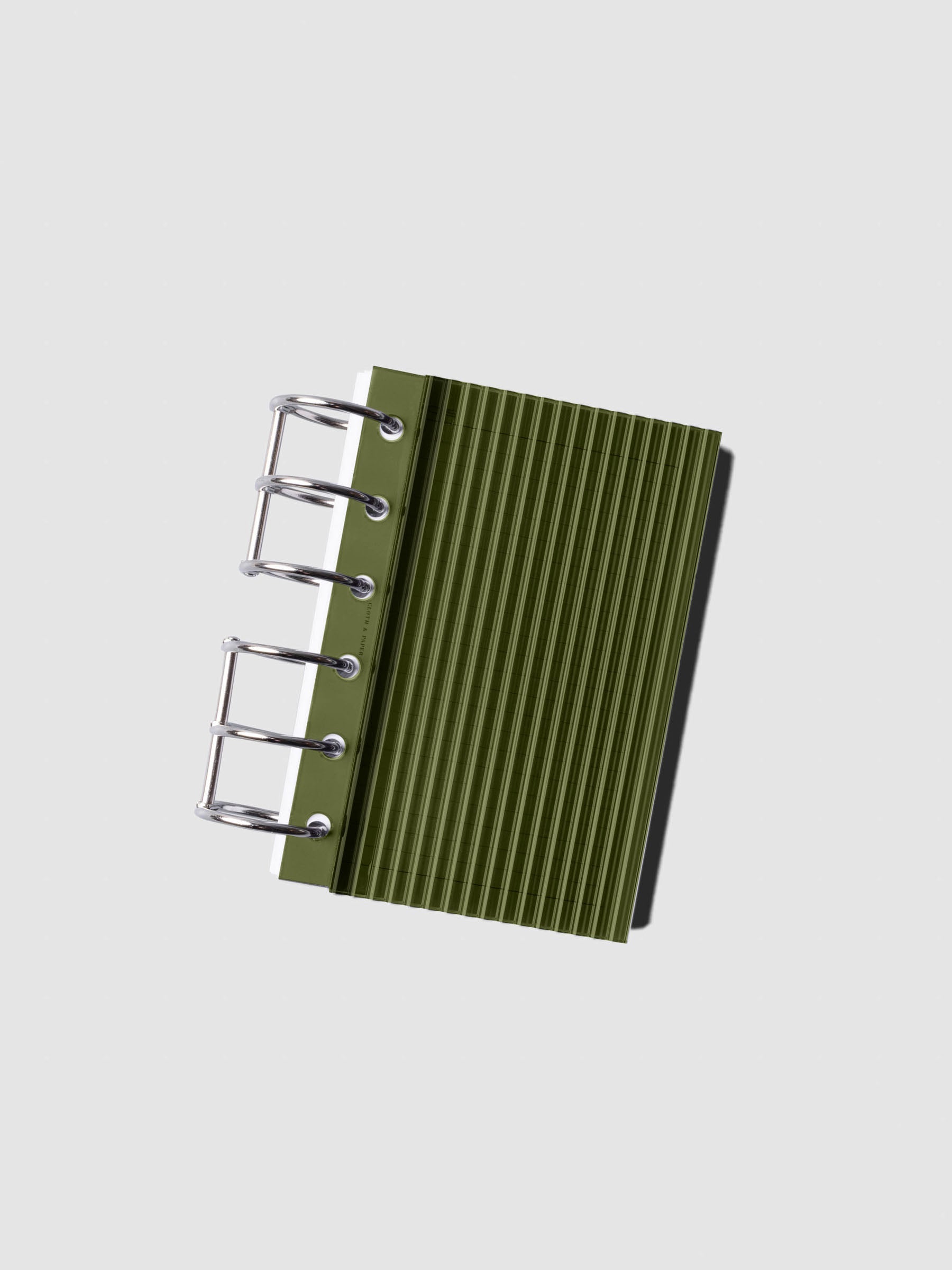 Olive fluted planner dashboard in Pocket size shown on silver six rings at an angle, no cover.