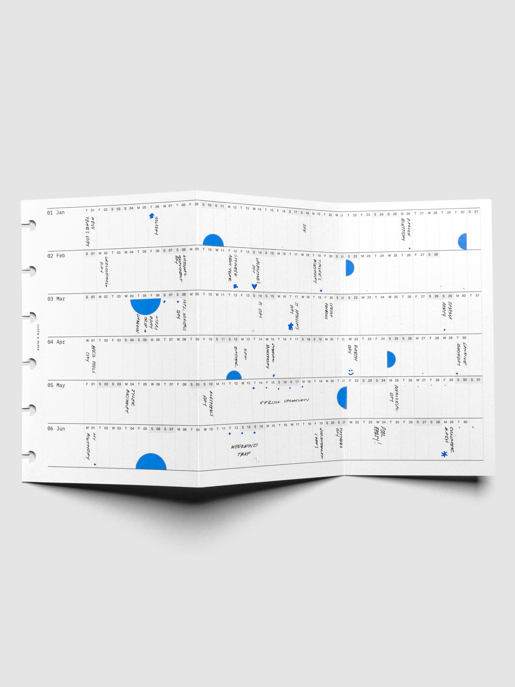 Semicircle Sticker Set in Hyacinth blue in use on a planner insert.