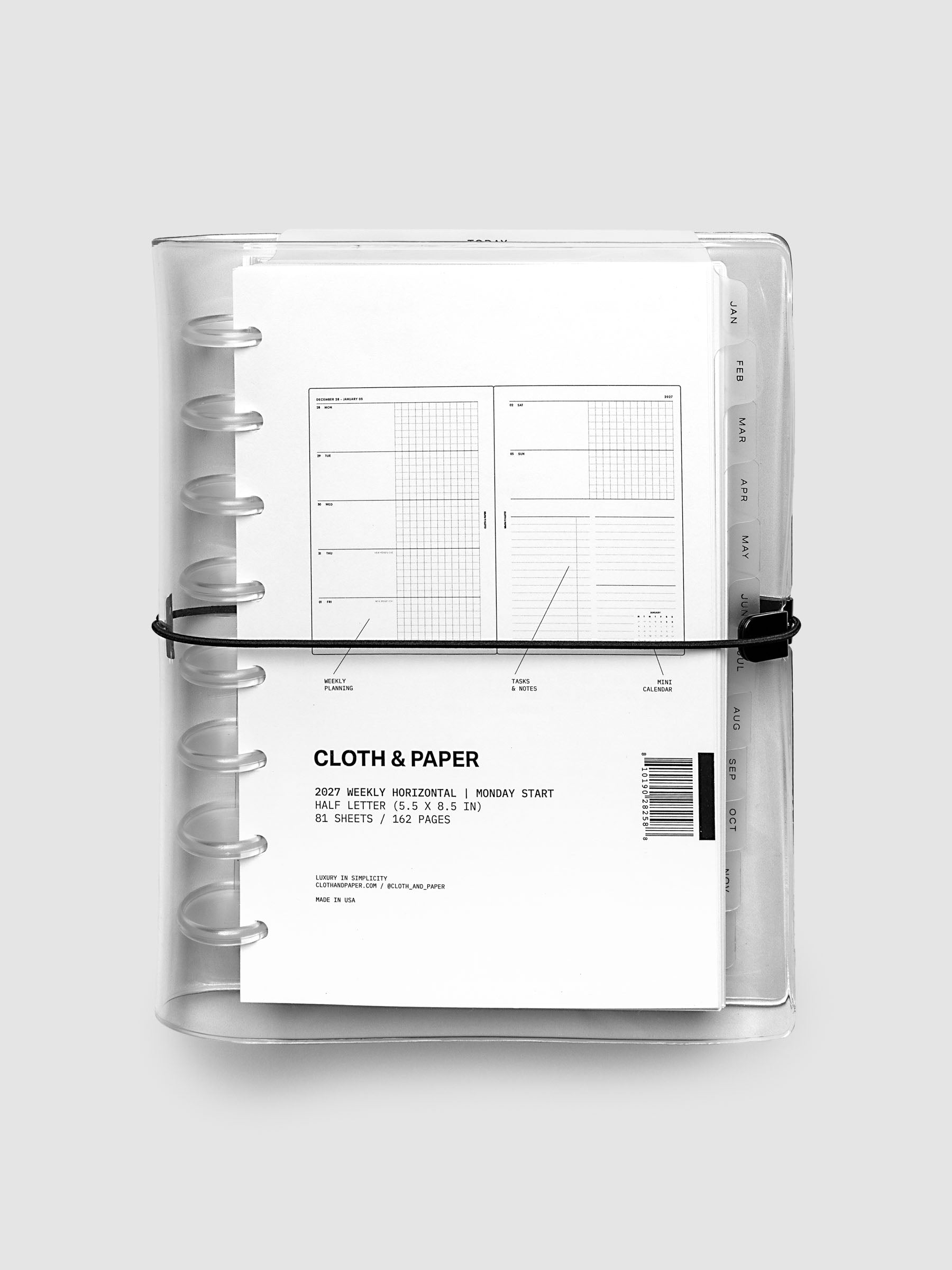 Closed clear vinyl planner cover with clear 8-disc binding and a black elastic closure, front page displaying a labeled weekly horizontal spread with weekly planning, tasks and notes, and mini calendar callouts, Half Letter 8-Disc Punch size