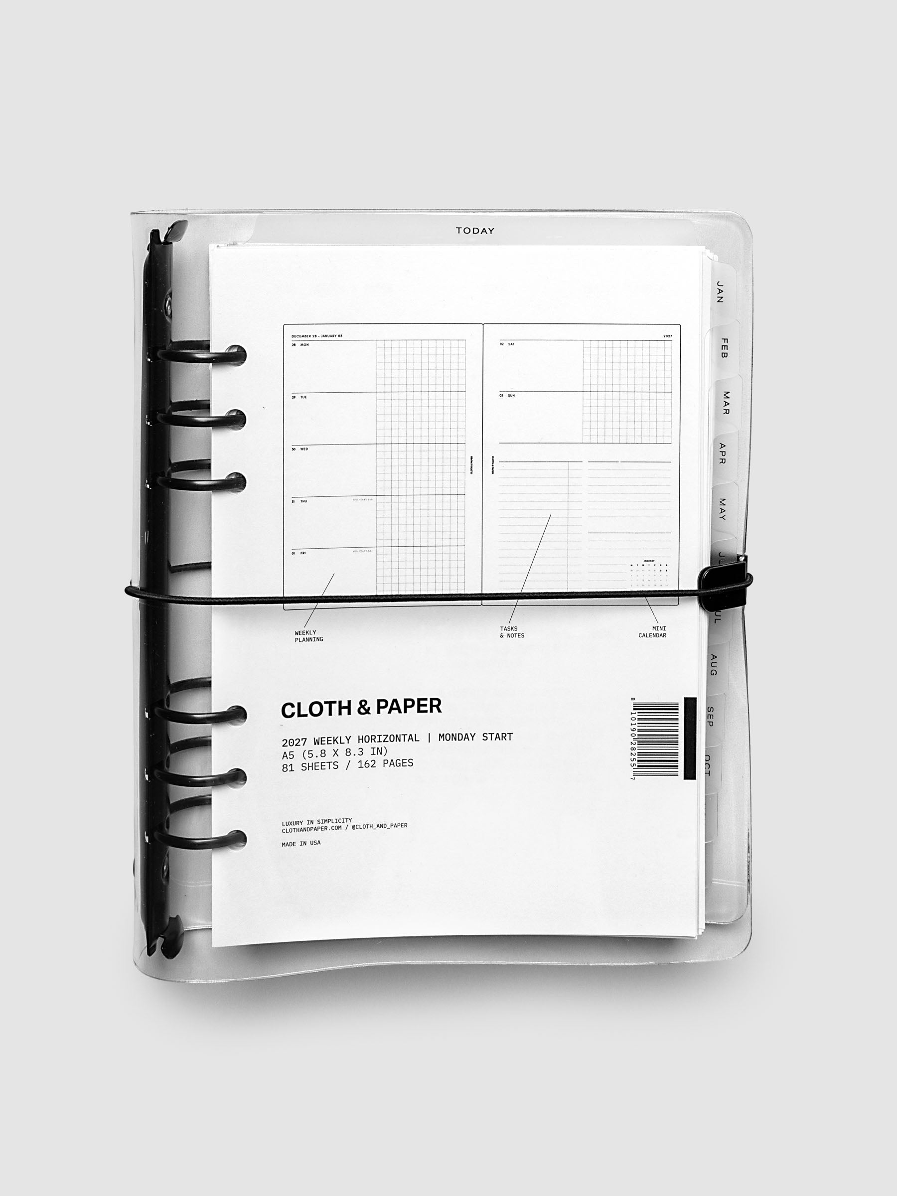 Closed clear vinyl planner cover with black 6-ring binding and a black elastic closure, front page displaying a labeled weekly horizontal spread with weekly planning, tasks and notes, and mini calendar callouts, A5 6-Ring Punch size