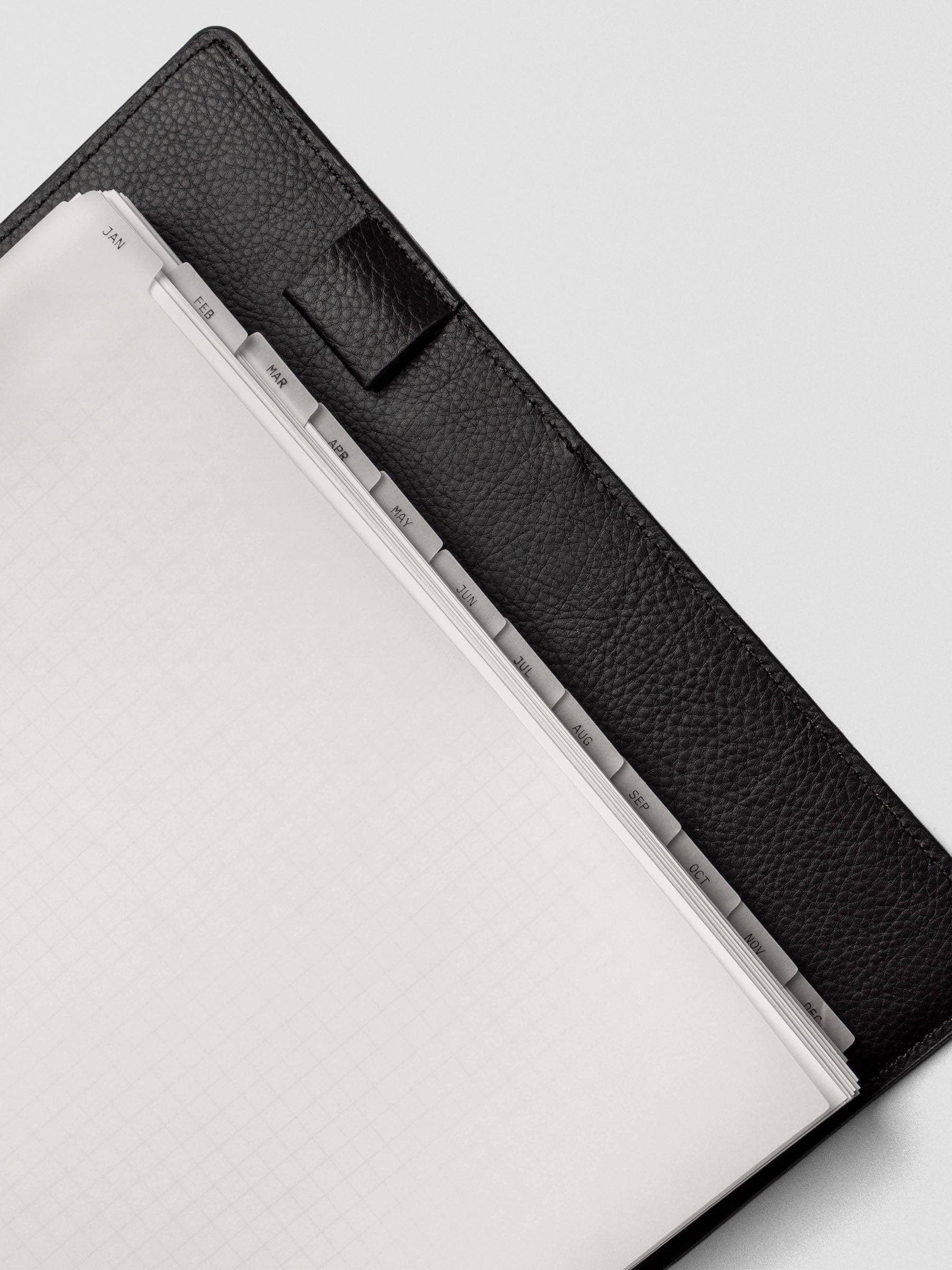 Close up of HP Classic vellum dividers shown at an angle bound with discs in a folio.