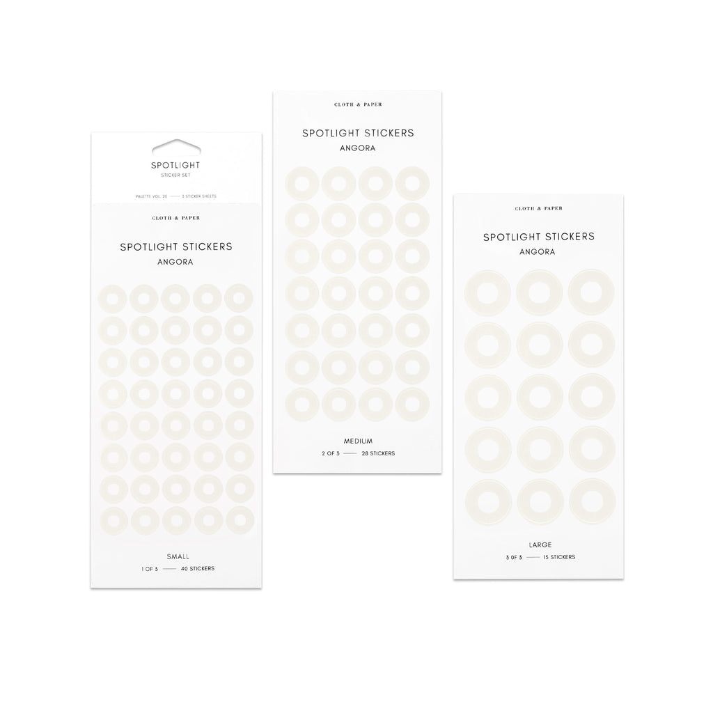 Three sheets of spotlight stickers in small, medium, and large sizing arranged together on a white background.