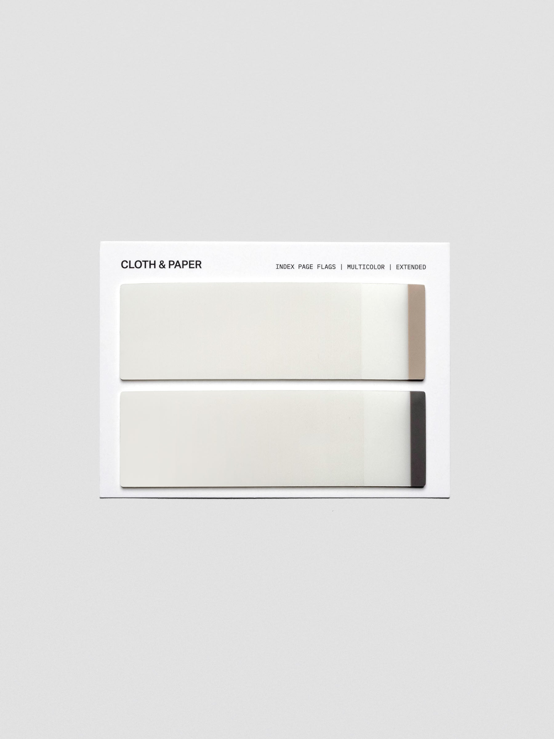 A multicolor pack of extended transparent page flags with colored tips in light and dark brown.