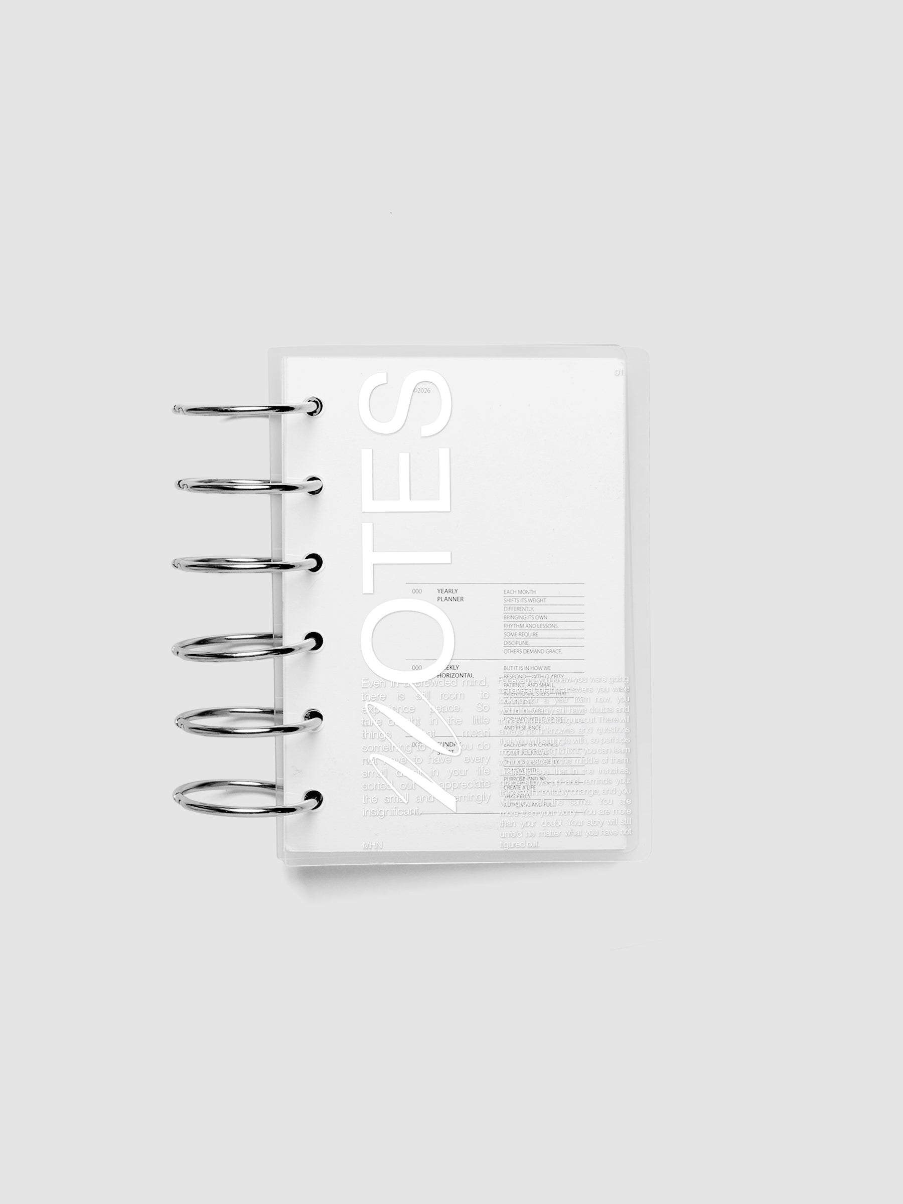 Clear plastic planner cover with white printed text shown pre-punched for Pocket 6-ring planners.