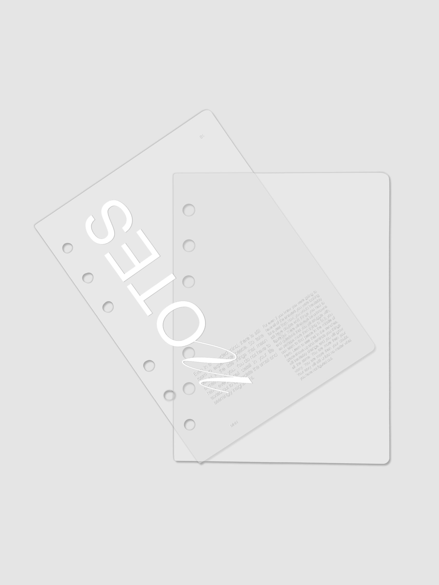 Clear plastic planner cover with white printed text shown pre-punched for A6 6-ring planners.