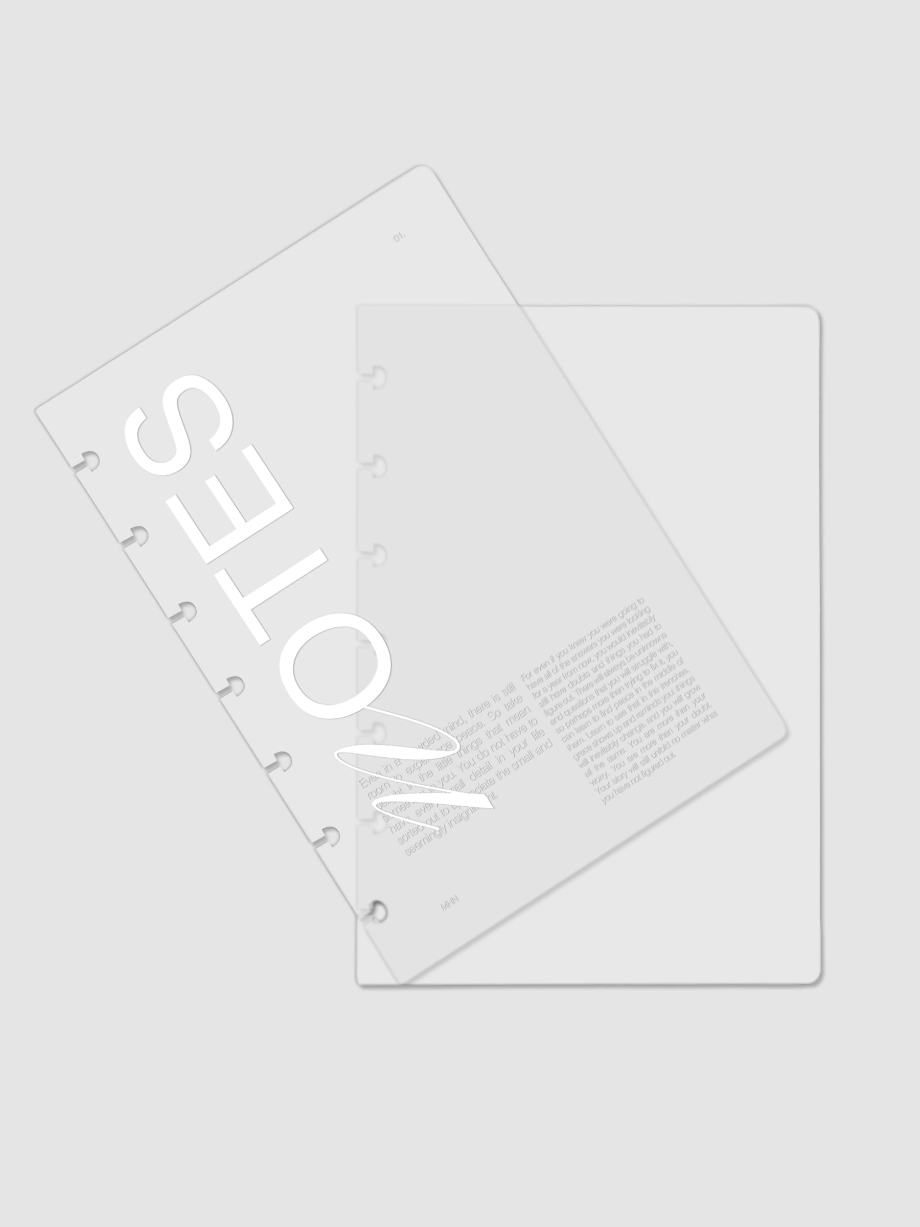 Clear plastic planner cover with white printed text shown pre-punched for HP Mini discbound planners.