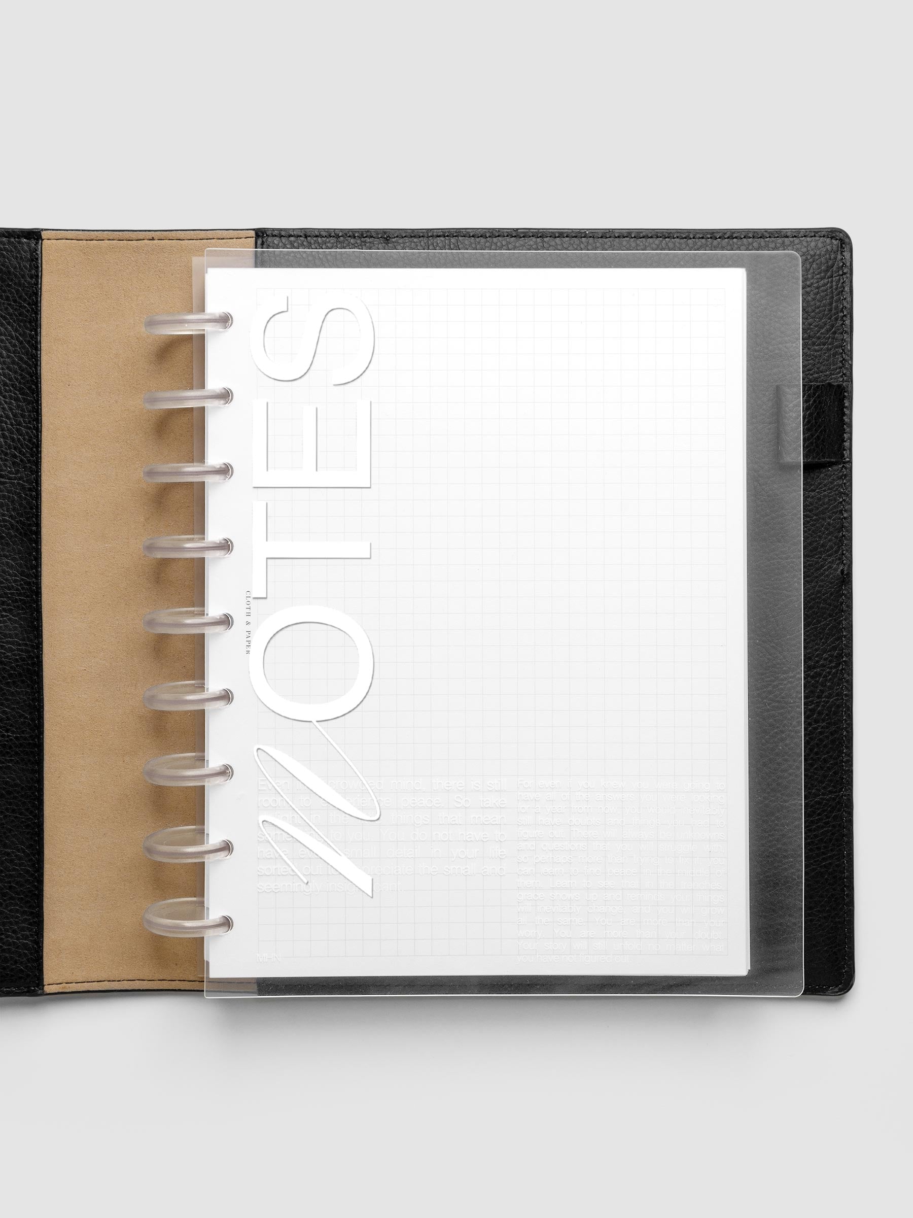 Clear plastic planner cover with white printed text shown pre-punched for HP Classic discbound planners.