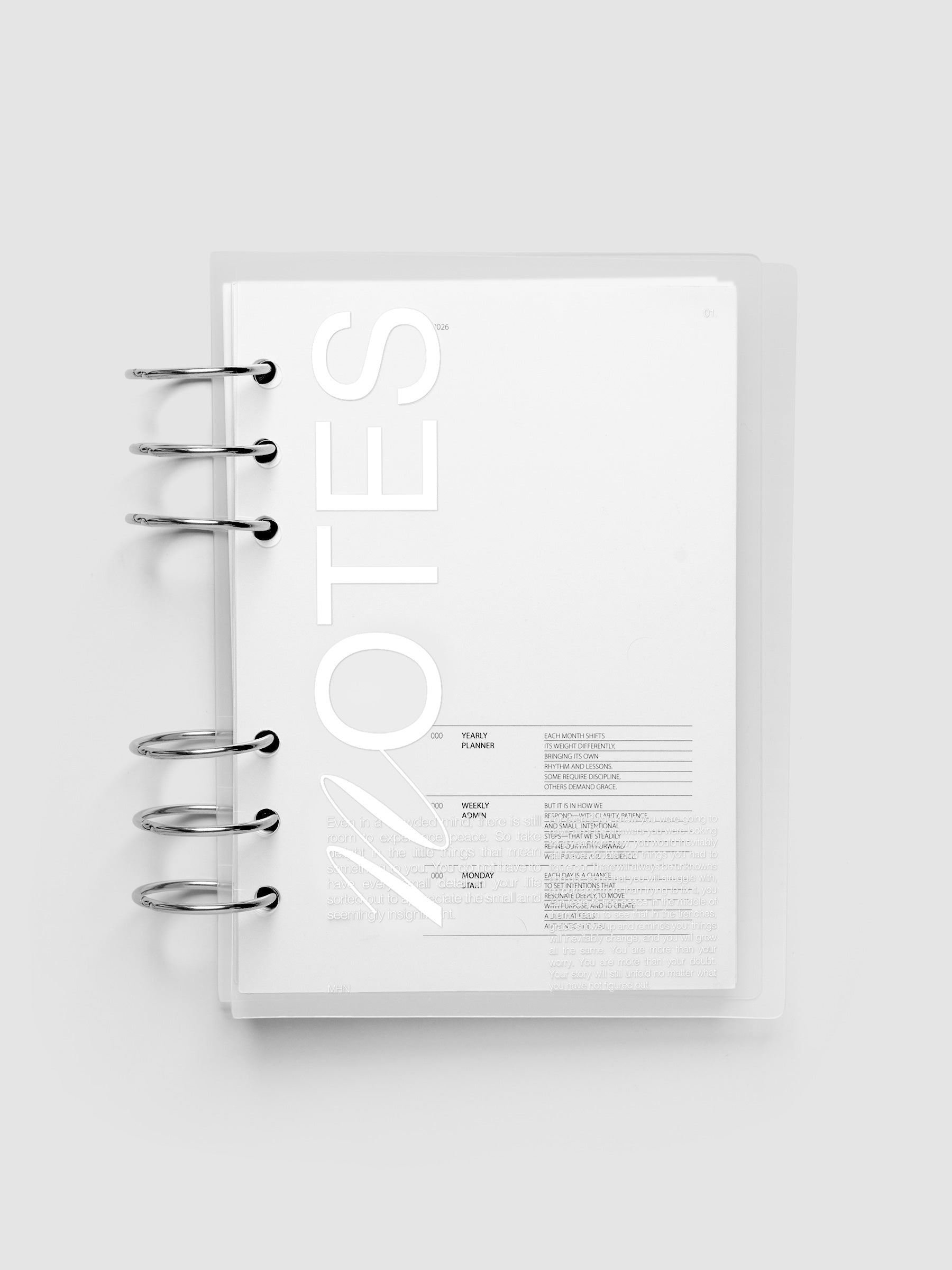 Clear plastic planner cover with white printed text shown pre-punched for Personal Wide 6-ring planners.