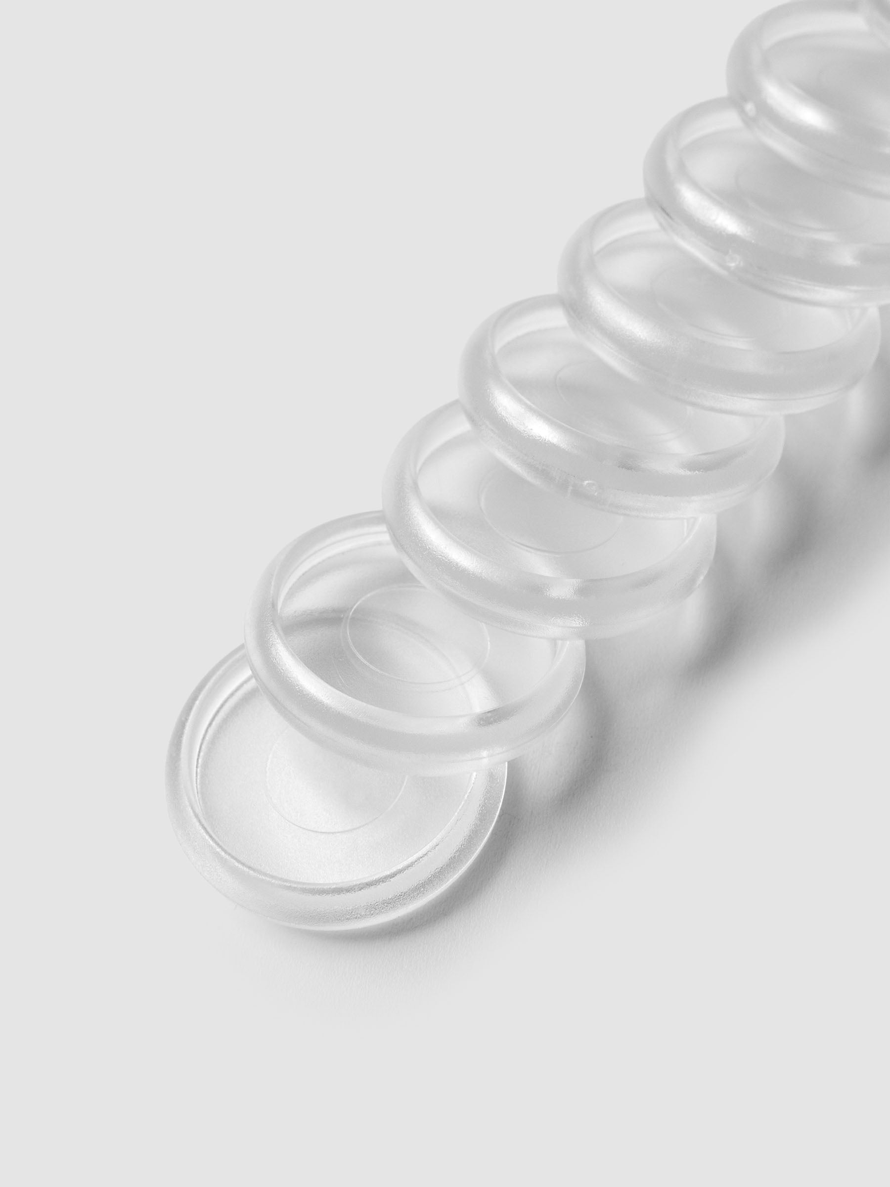 Close up view of 1 inch clear, transparent planner discs.
