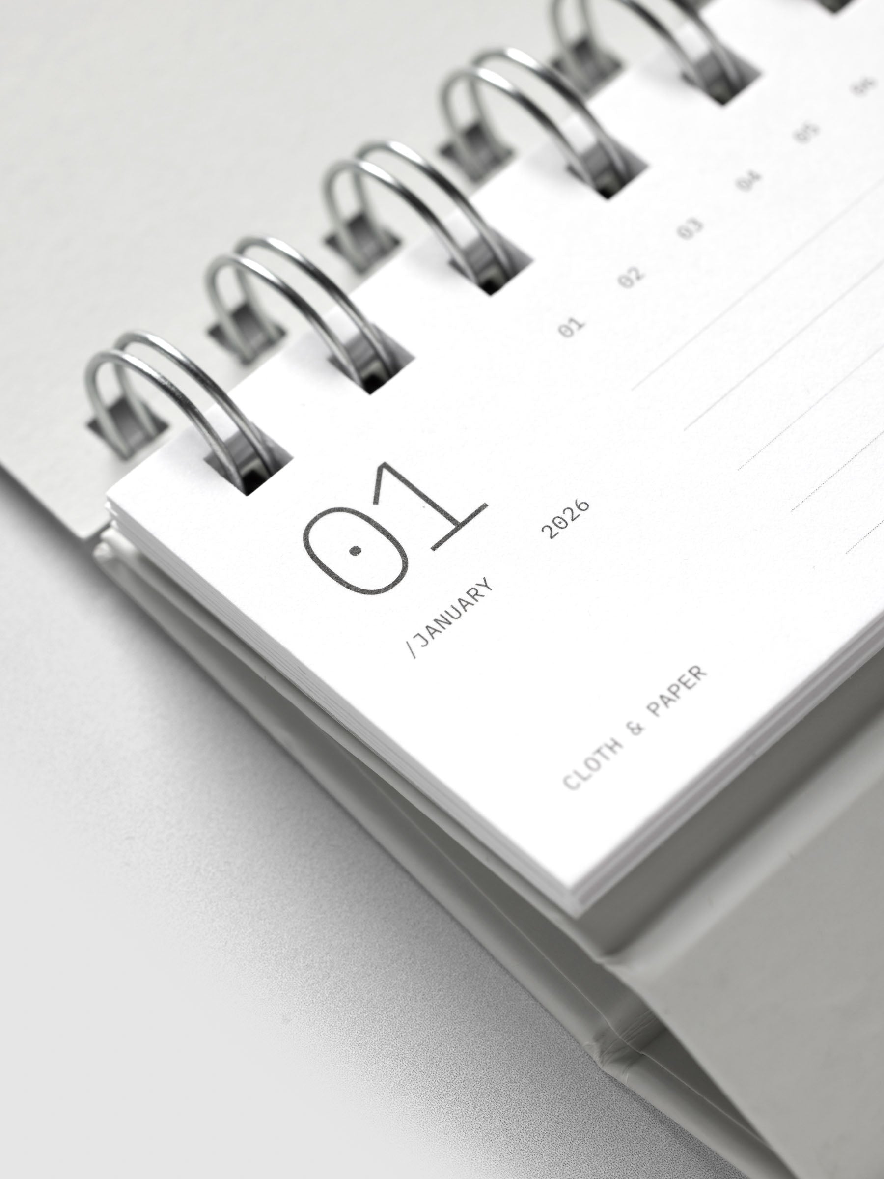 Close up of 2026 Spiral Desk Calendar shown folded and flat, displaying a calendar page.